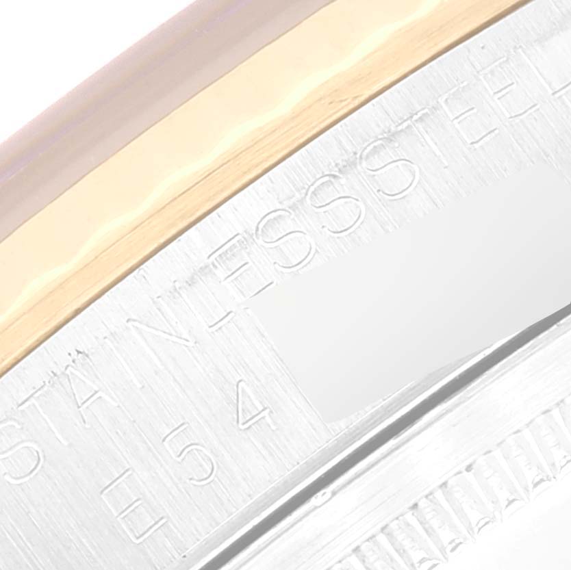 This image shows an angled close-up of the inscription on the side of the bezel and case of a Rolex Datejust 16233 Men's Steel and Gold (two tone) Black Dial 16233 Men's Steel and Gold (two tone) Black Dial watch.