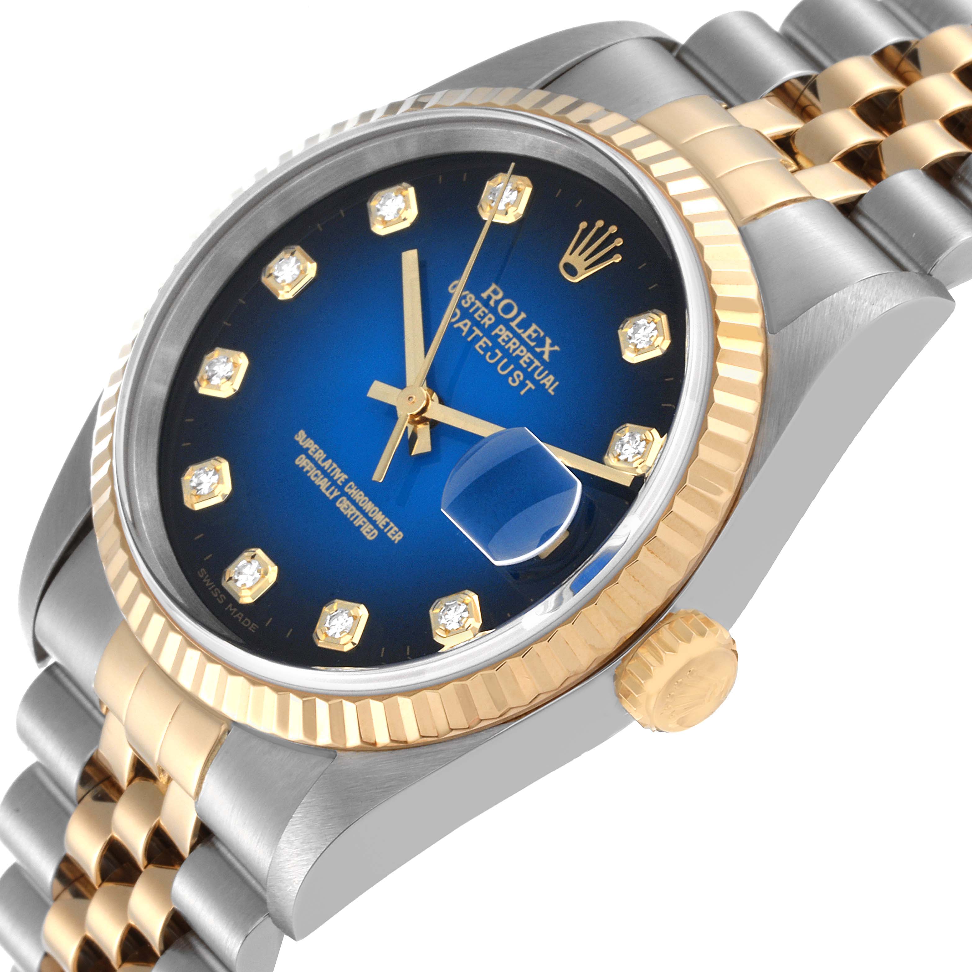 This image shows a close-up angled view of a Rolex Datejust 16233 Men's Steel and Gold (two tone) Blue Dial 16233 Men's Steel and Gold (two tone) Blue Dial watch, highlighting the bezel, crown, dial, and bracelet.