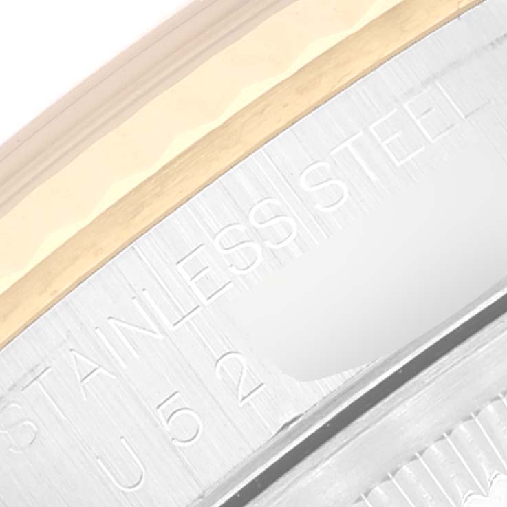 The image shows a close-up of the case side with partial engraving on the Rolex Datejust 16233 Men's Steel and Gold (two tone) Blue Dial 16233 Men's Steel and Gold (two tone) Blue Dial watch.