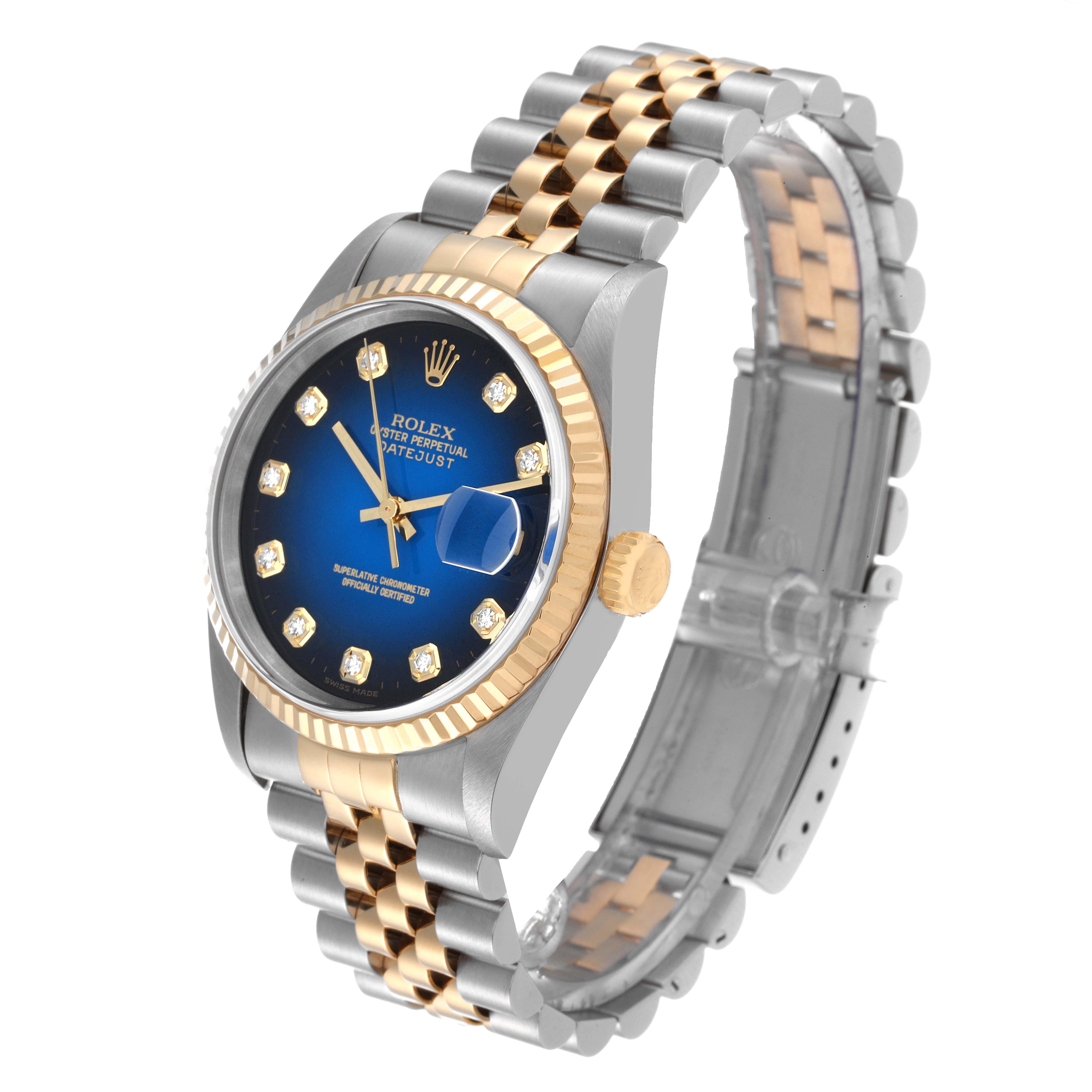 The image shows a Rolex Datejust 16233 Men's Steel and Gold (two tone) Blue Dial 16233 Men's Steel and Gold (two tone) Blue Dial watch at a three-quarter angle, highlighting its blue dial, diamond markers, and two-tone bracelet.