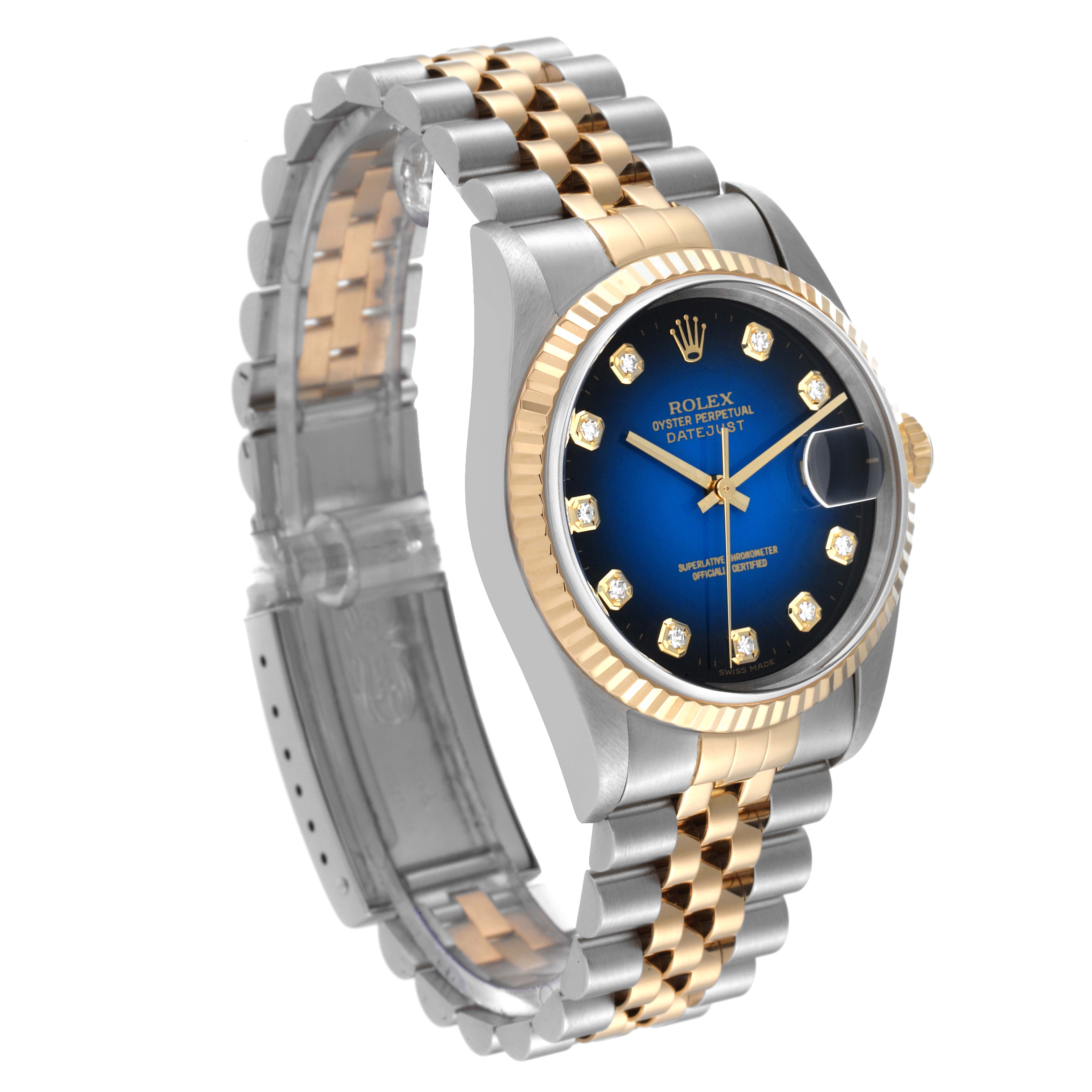 The image shows a Rolex Datejust 16233 Men's Steel and Gold (two tone) Blue Dial 16233 Men's Steel and Gold (two tone) Blue Dial watch from a three-quarter angle, highlighting the face, gold bezel, crown, and two-tone bracelet.