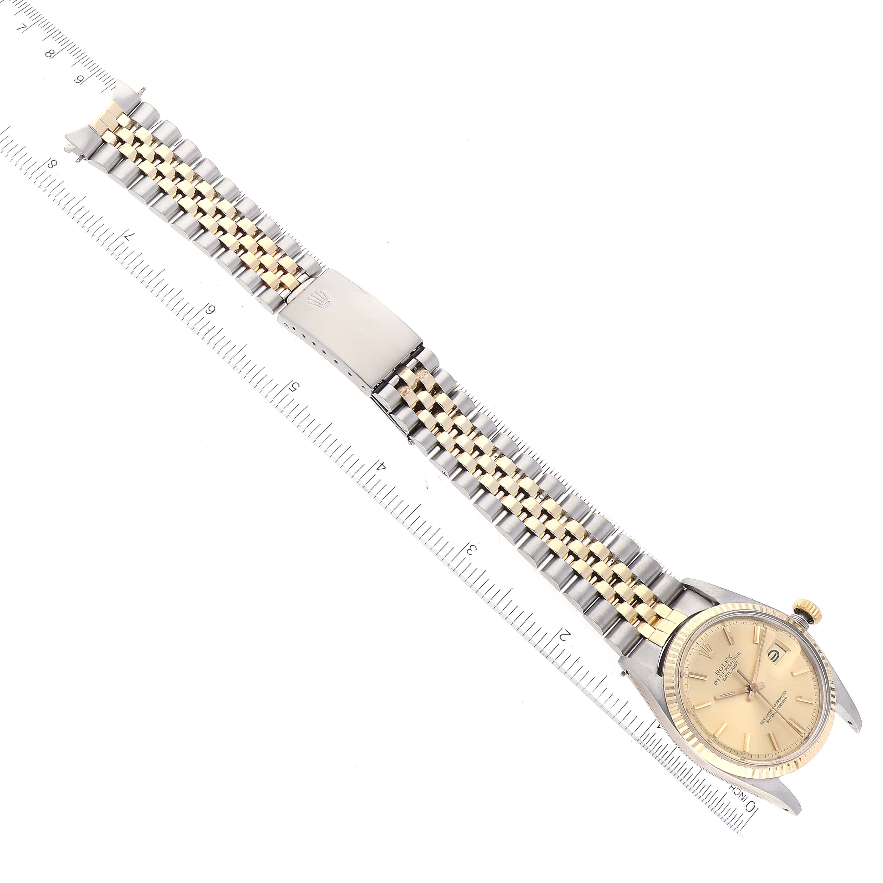 The image shows a Rolex Vintage Collection 1601 Men's Steel and Gold (two tone) Champagne Dial 1601 Men's Steel and Gold (two tone) Champagne Dial watch viewed from above, highlighting its two-tone metal bracelet and face.