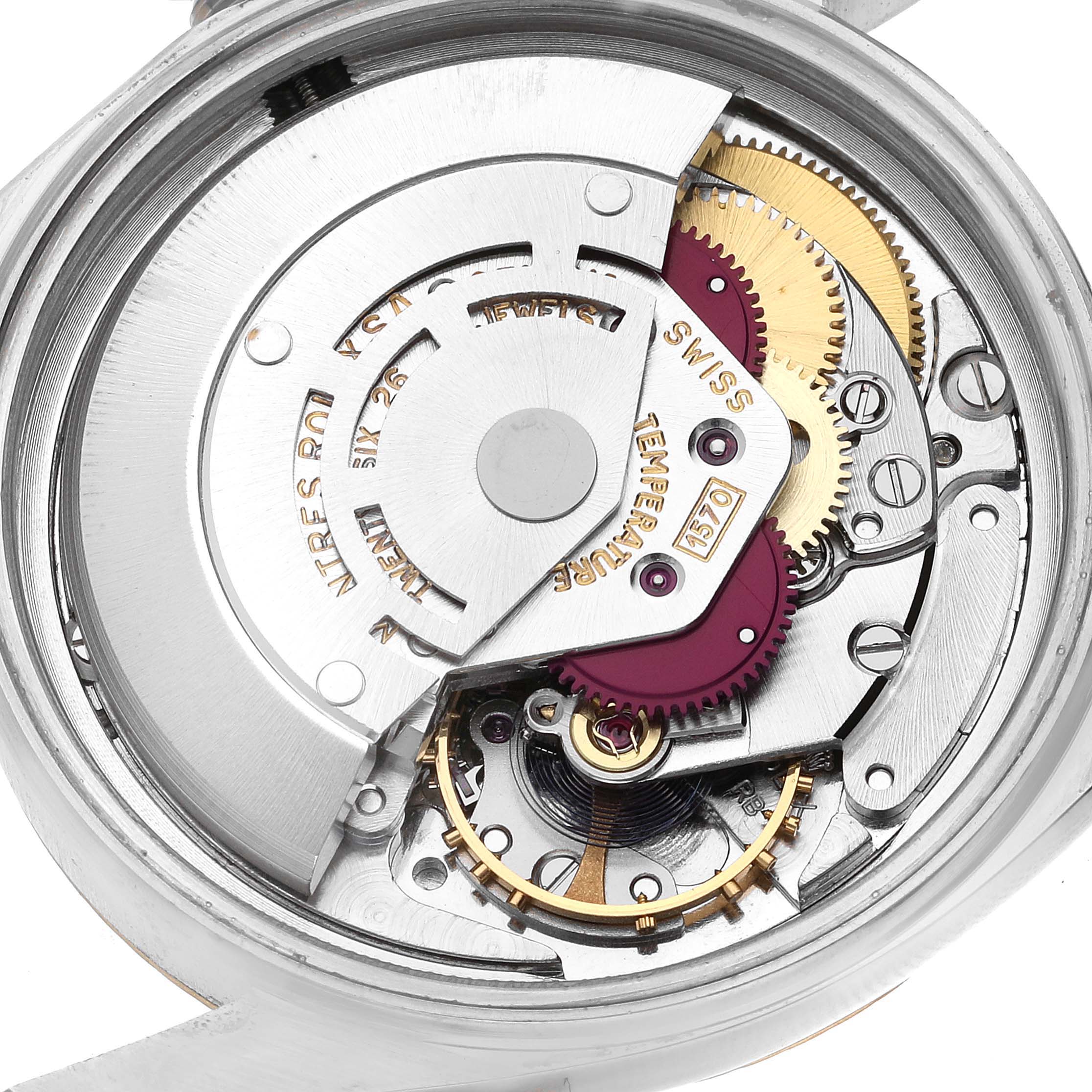 The image shows the intricate internal mechanism of a Rolex Vintage Collection 1601 Men's Steel and Gold (two tone) Champagne Dial 1601 Men's Steel and Gold (two tone) Champagne Dial watch from a close-up, top-down angle.