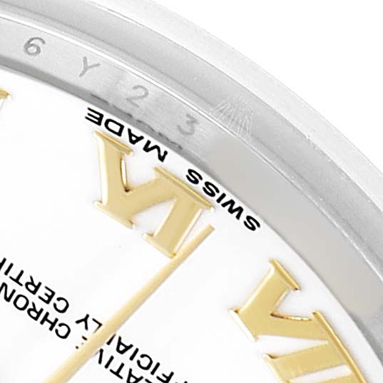 This image shows a close-up of the Rolex Datejust 69173 Women's Steel and Gold (two tone) White Dial's dial edge, highlighting the Roman numeral markers and outer bezel.