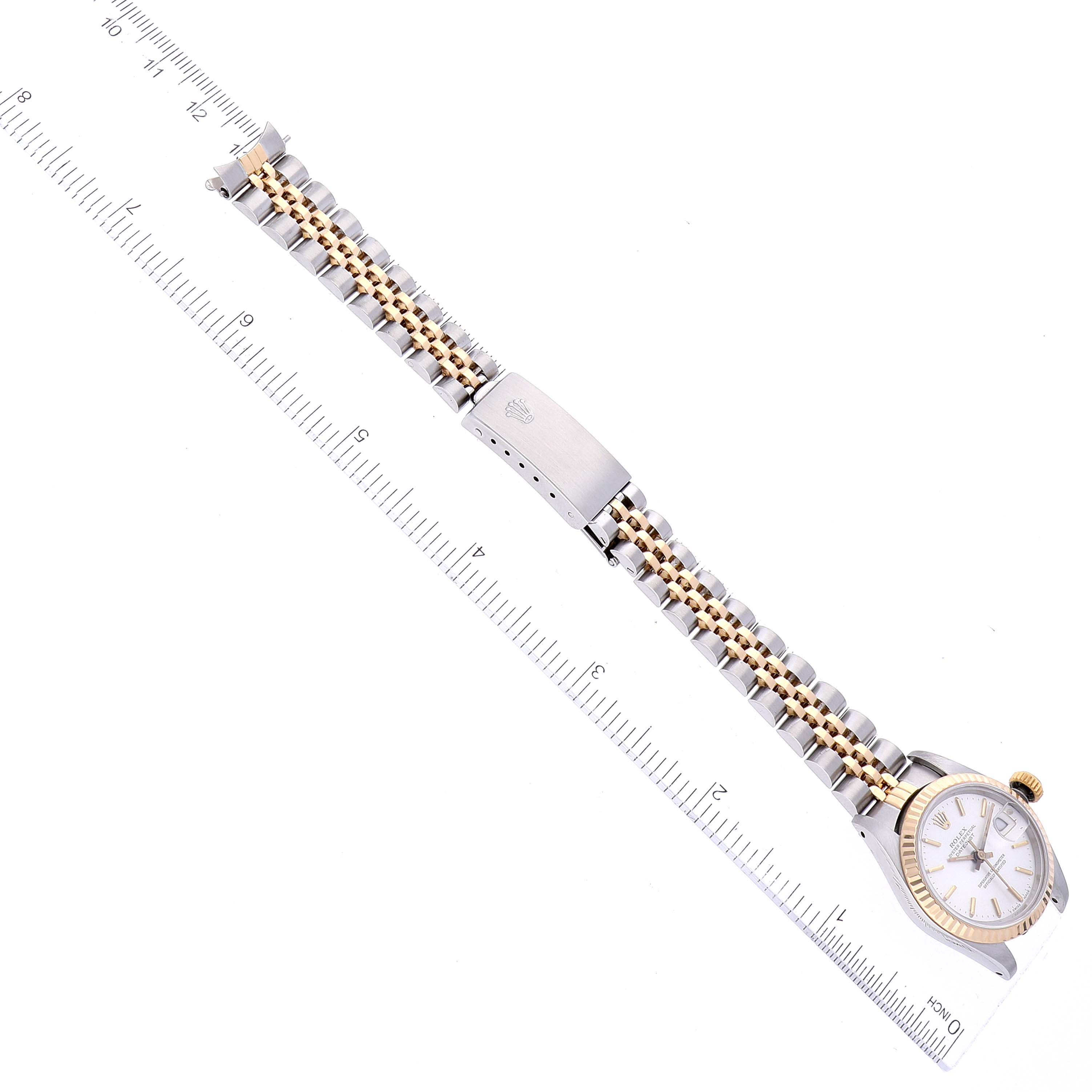 This image shows the Rolex Datejust 69173 Women's Steel and Gold (two tone) Silver Dial 69173 Women's Steel and Gold (two tone) Silver Dial watch lying flat with both the dial and metal bracelet fully visible; a ruler is alongside for measurement.