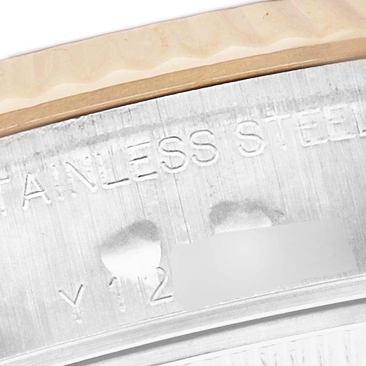 This image shows a close-up of the serial number and "STAINLESS STEEL" engraving on the case of a Rolex Datejust 79173 Women's Steel and Gold (two tone) Silver Dial 79173 Women's Steel and Gold (two tone) Silver Dial watch.