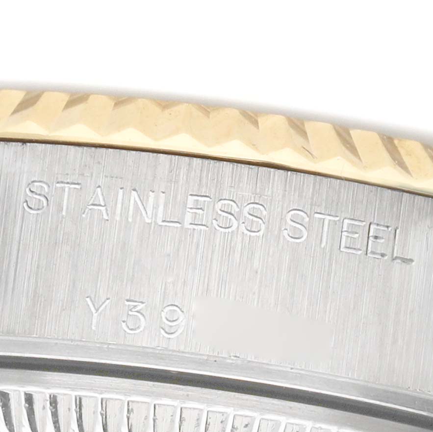 The image shows a close-up of the bezel and case of a Rolex Datejust 79173 Women's Steel and Gold (two tone) Silver Dial, highlighting the "STAINLESS STEEL" engraving.