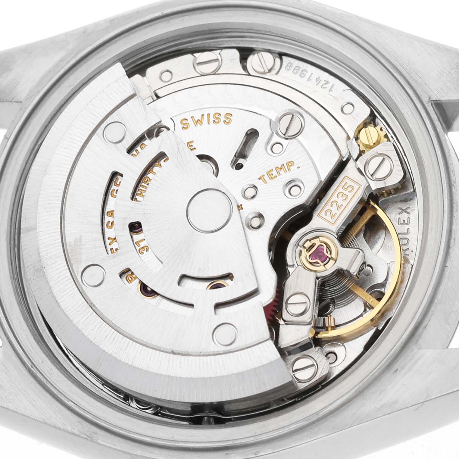 The image shows the movement mechanism of a Rolex Datejust 79173 Women's Steel and Gold (two tone) Silver Dial watch from a rear angle, highlighting mechanical parts and engravings.