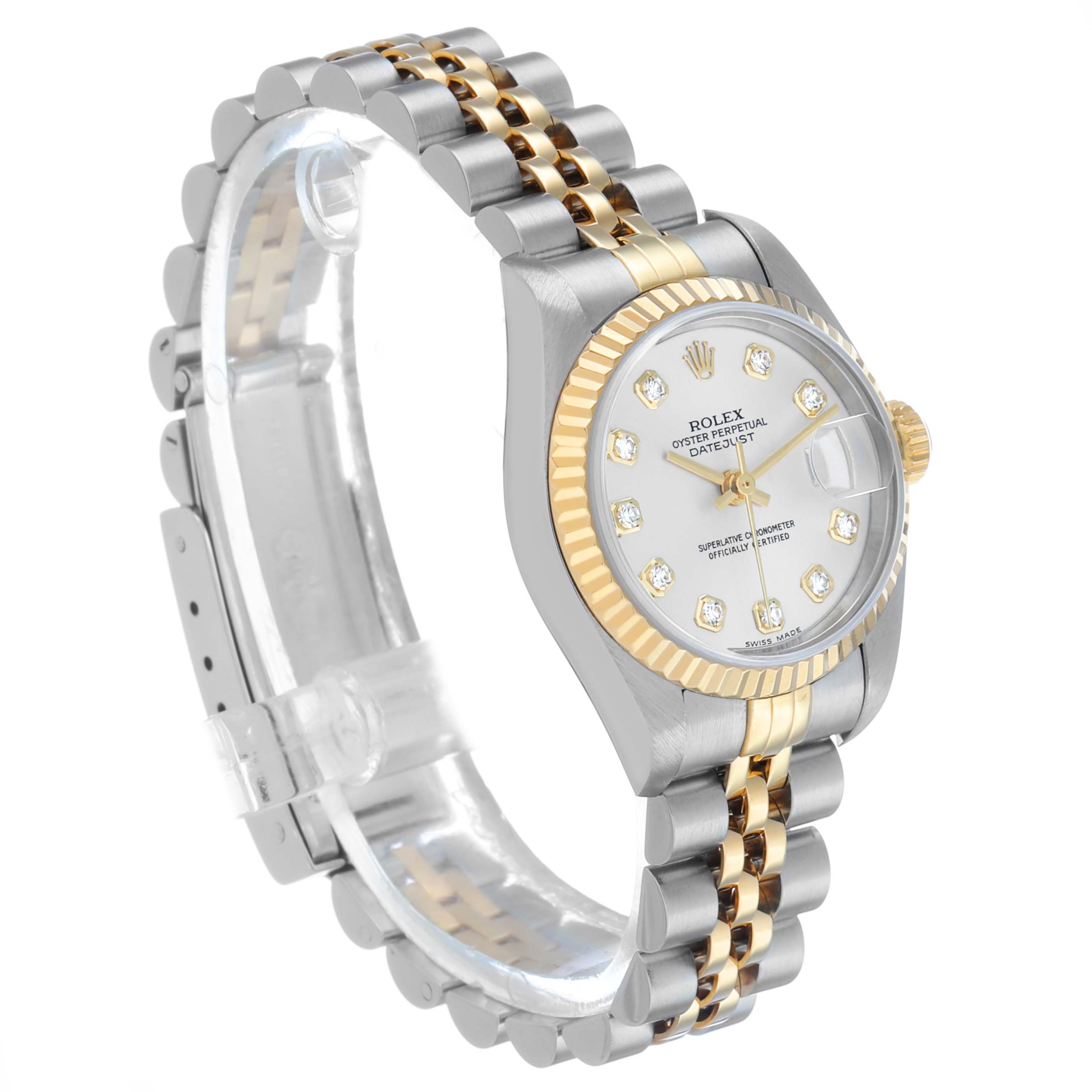 The Rolex Datejust 79173 Women's Steel and Gold (two tone) Silver Dial watch is shown in a three-quarter angle, highlighting the dial, case, bezel, and Jubilee bracelet.