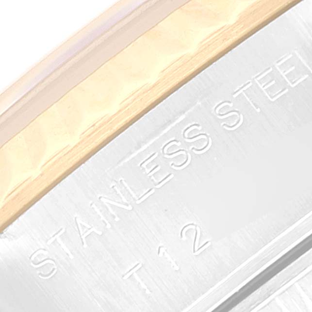 This is a close-up of the case side of a Rolex Datejust 69173 Women's Steel and Gold (two tone) Grey Dial 69173 Women's Steel and Gold (two tone) Grey Dial watch, showing the "STAINLESS STEEL" engraving.