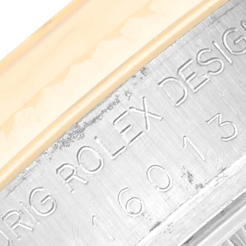 This close-up image shows the engraved design details and part of the bezel of the Vintage Collection model by Rolex.