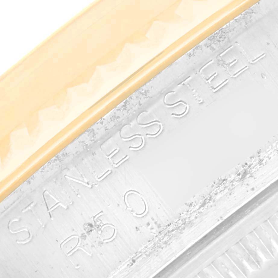 The image shows a close-up of the "STAINLESS STEEL" engraving on the bezel of a Rolex Vintage Collection 16013 Men's Steel and Gold (two tone) Champagne Dial 16013 Men's Steel and Gold (two tone) Champagne Dial model.