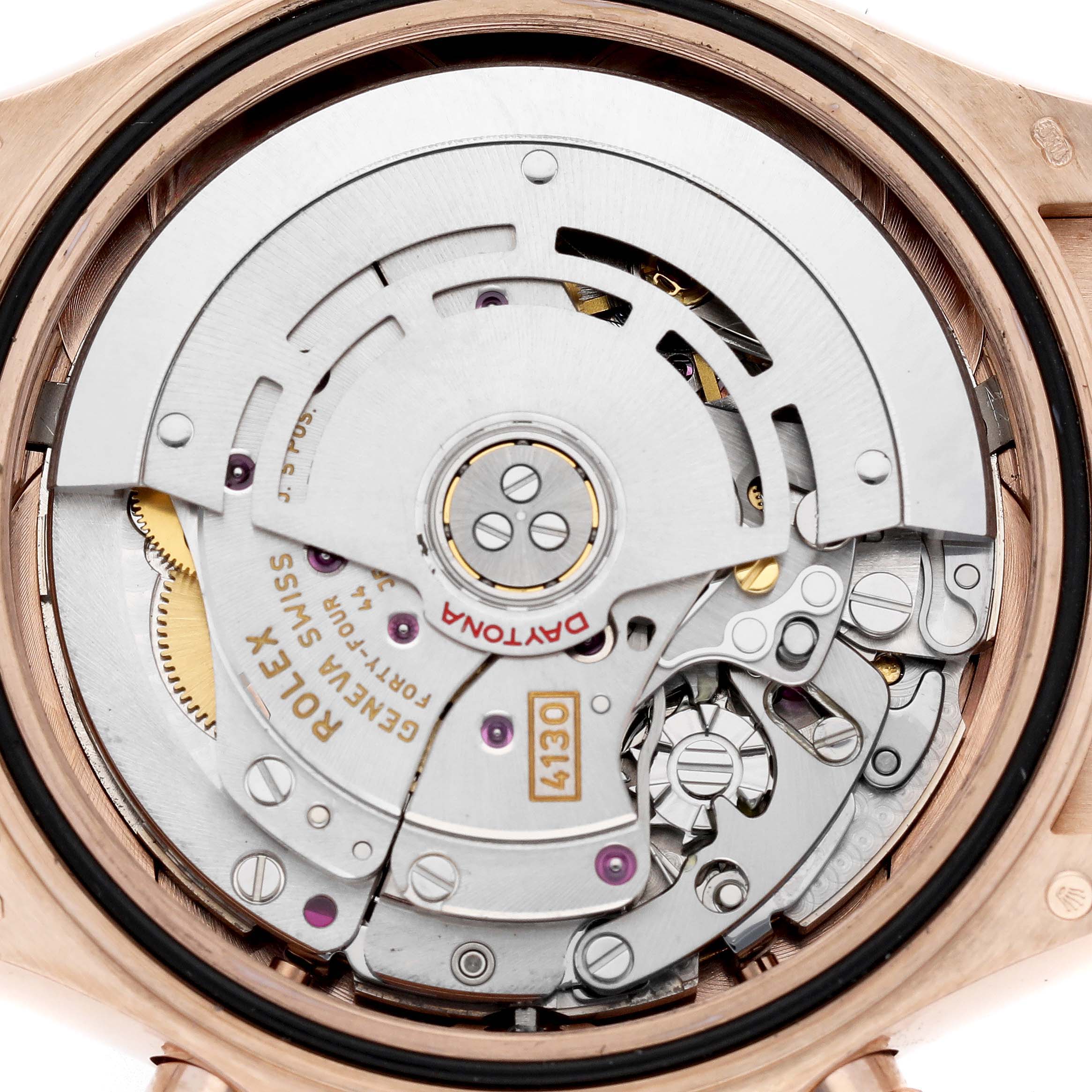 The image shows the movement and intricate components of a Rolex Daytona 116515LN Men's Rose Gold Brown Dial watch, viewed from the back.
