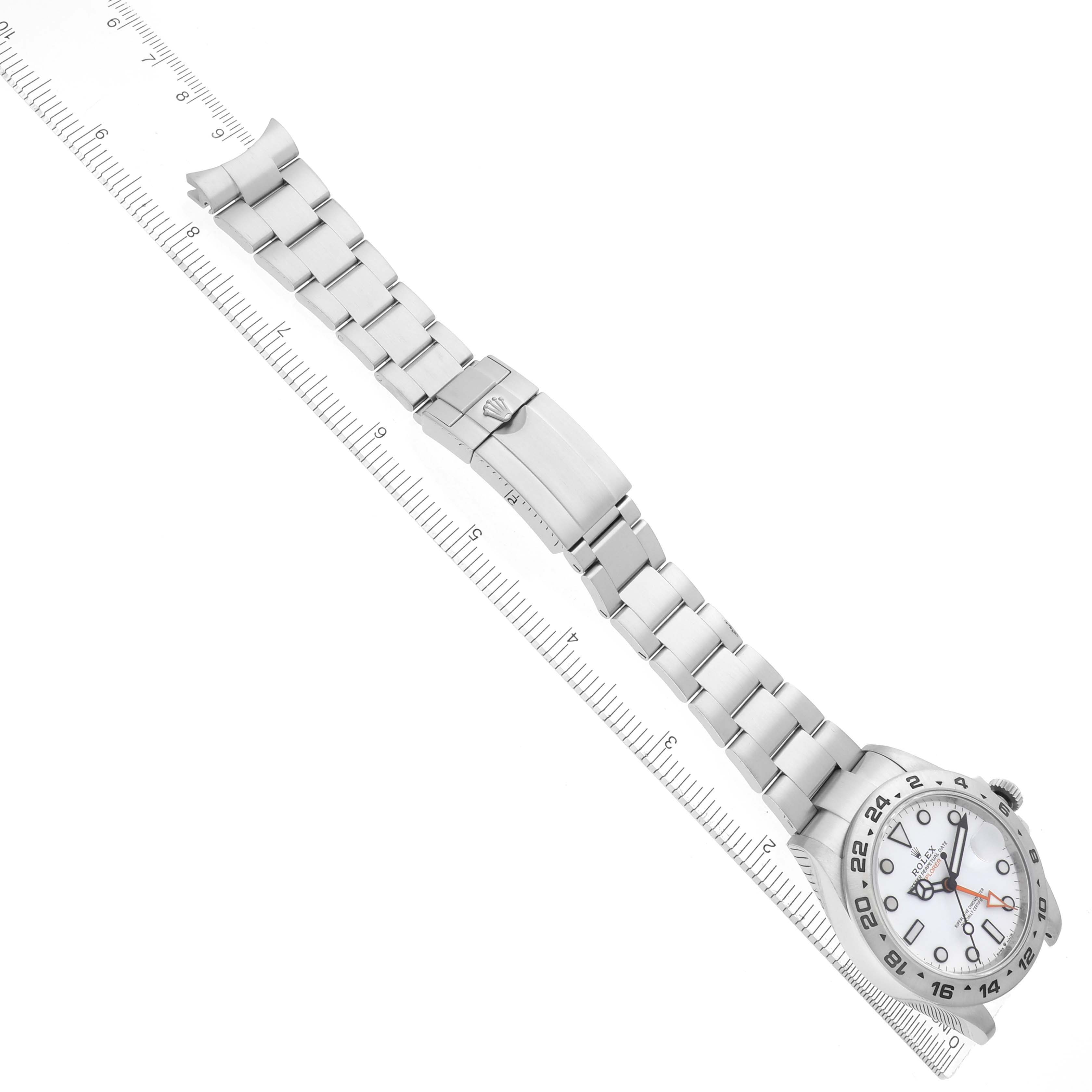 The Rolex Explorer 226570 Men
s Stainless Steel White Dial 226570 Men
s Stainless Steel White Dial watch is shown laid flat, displaying the face and full metal bracelet along with the clasp.