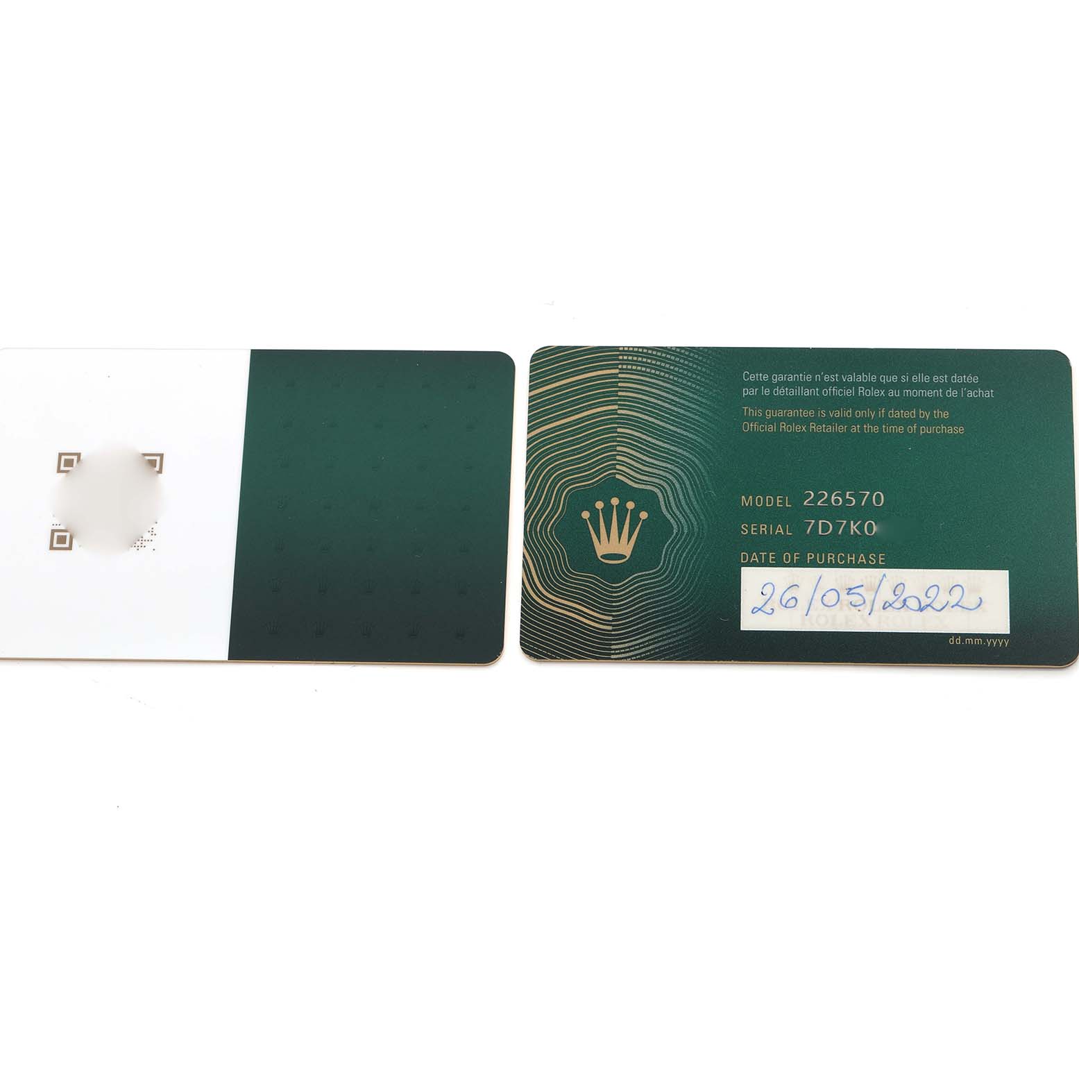 The image shows two green Rolex Explorer 226570 Men
s Stainless Steel White Dial 226570 Men
s Stainless Steel White Dial model 226570 guarantee cards, including the date of purchase.