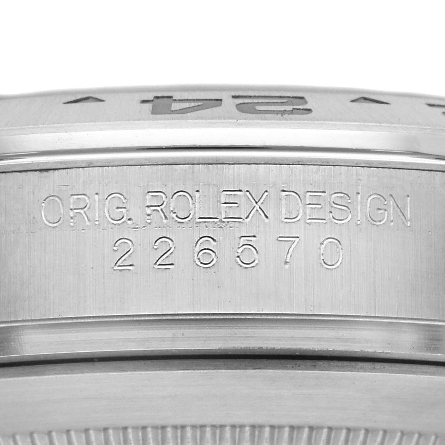 The image shows a close-up of the engraved side of a Rolex Explorer 226570 Men
s Stainless Steel White Dial 226570 Men
s Stainless Steel White Dial watch, focusing on the model number and design inscription.