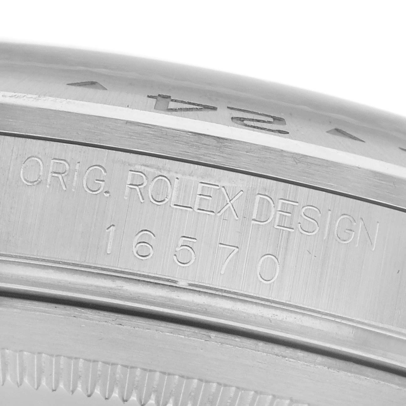 The image shows a close-up of the side of a Rolex Explorer 16570 Men
s Stainless Steel White Dial 16570 Men
s Stainless Steel White Dial watch, displaying the engraved model number and "ORIG. ROLEX DESIGN."