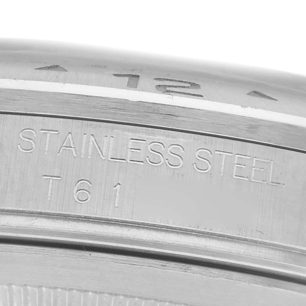 The image shows a close-up of the side of a stainless steel Rolex Explorer 16570 Men
s Stainless Steel White Dial 16570 Men
s Stainless Steel White Dial, featuring engraved details.
