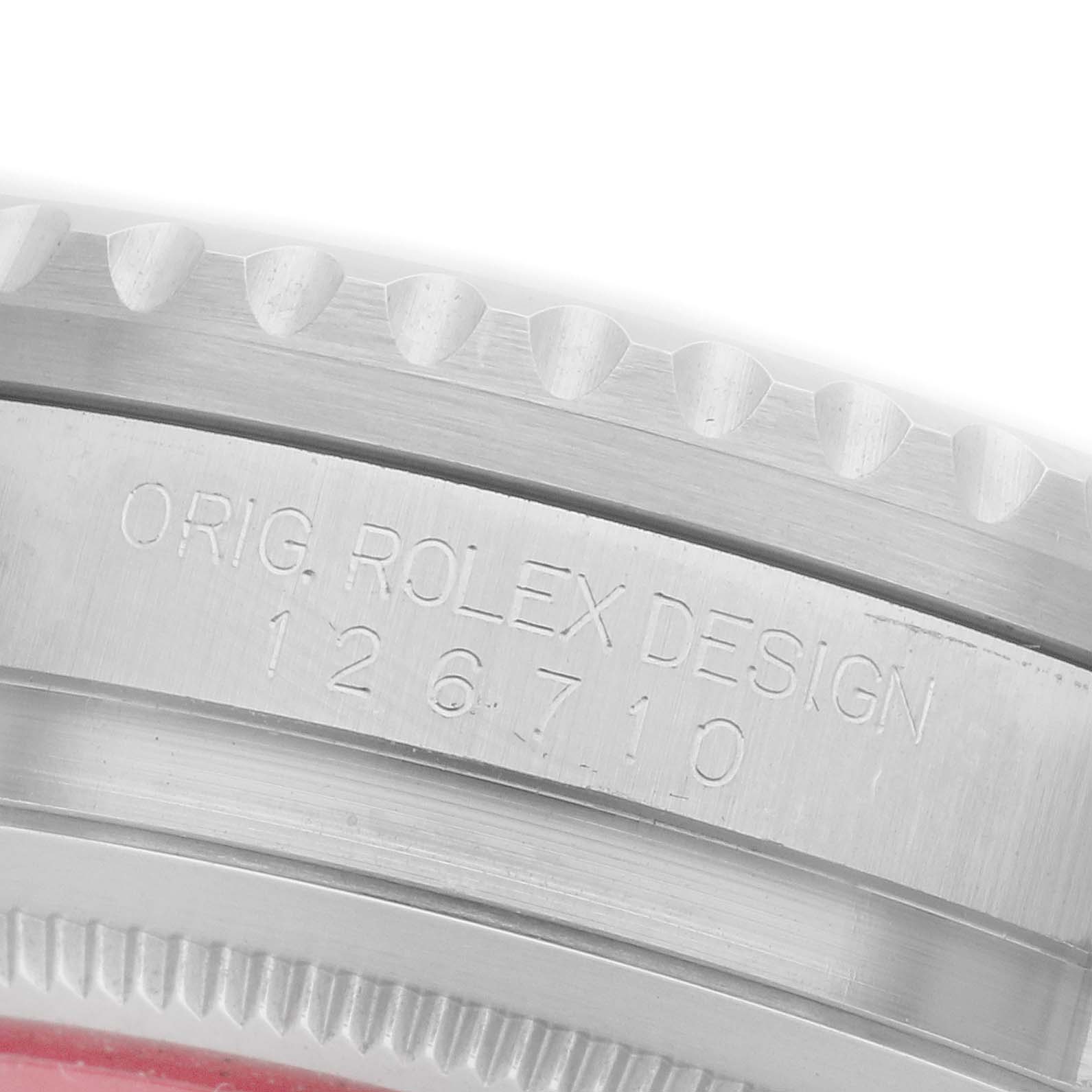 The image shows a close-up of the side of the Rolex GMT-Master 126710BLRO Men
s Stainless Steel Black Dial 126710BLRO Men
s Stainless Steel Black Dial, highlighting the case edge and engraved reference number.