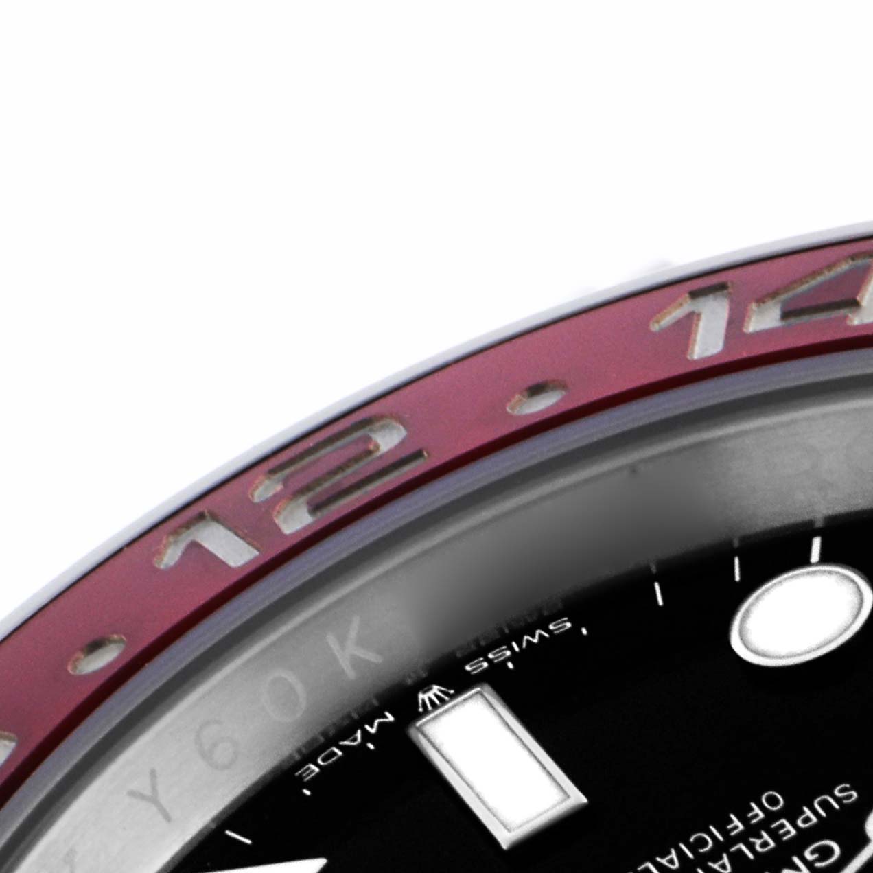The image shows the edge of the bezel and part of the dial of a Rolex GMT-Master 126710BLRO Men
s Stainless Steel Black Dial 126710BLRO Men
s Stainless Steel Black Dial, including numbers and markers.