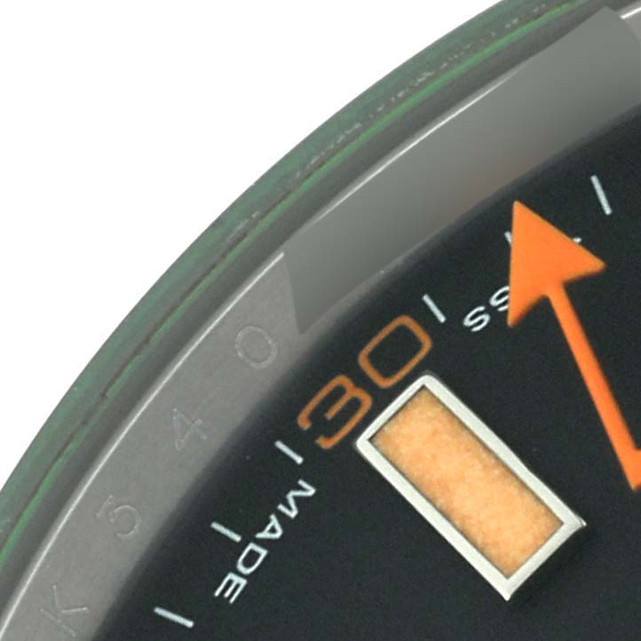 This close-up angle shows the minute markers and orange second hand of the Rolex Milgauss 116400GV Men's Stainless Steel Black Dial 116400GV Men's Stainless Steel Black Dial watch dial.