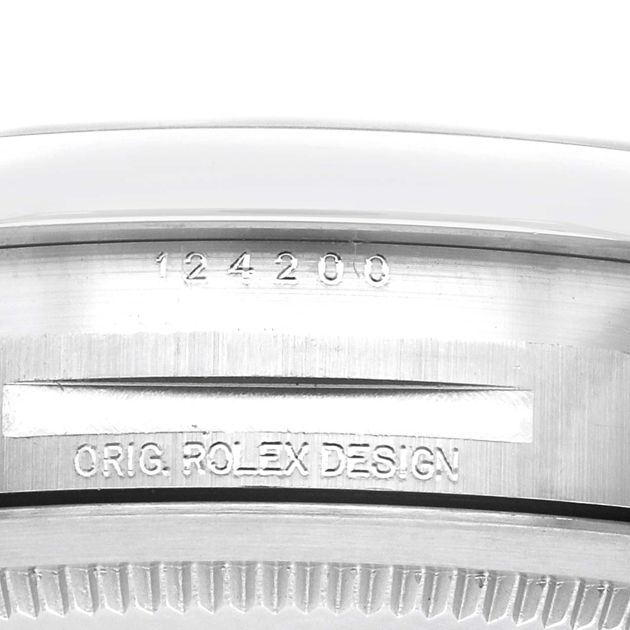 The image shows a close-up of the side case of a Rolex Oyster Perpetual 124200 Men
s Stainless Steel Pink Dial 124200 Men
s Stainless Steel Pink Dial, highlighting the engraved model number and "Orig. Rolex Design".