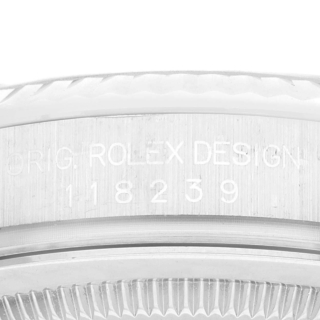 This image shows a close-up of the case side engraving on a Rolex President 118239 Men's White Gold Silver Dial 118239 Men's White Gold Silver Dial model, featuring the design and model number.