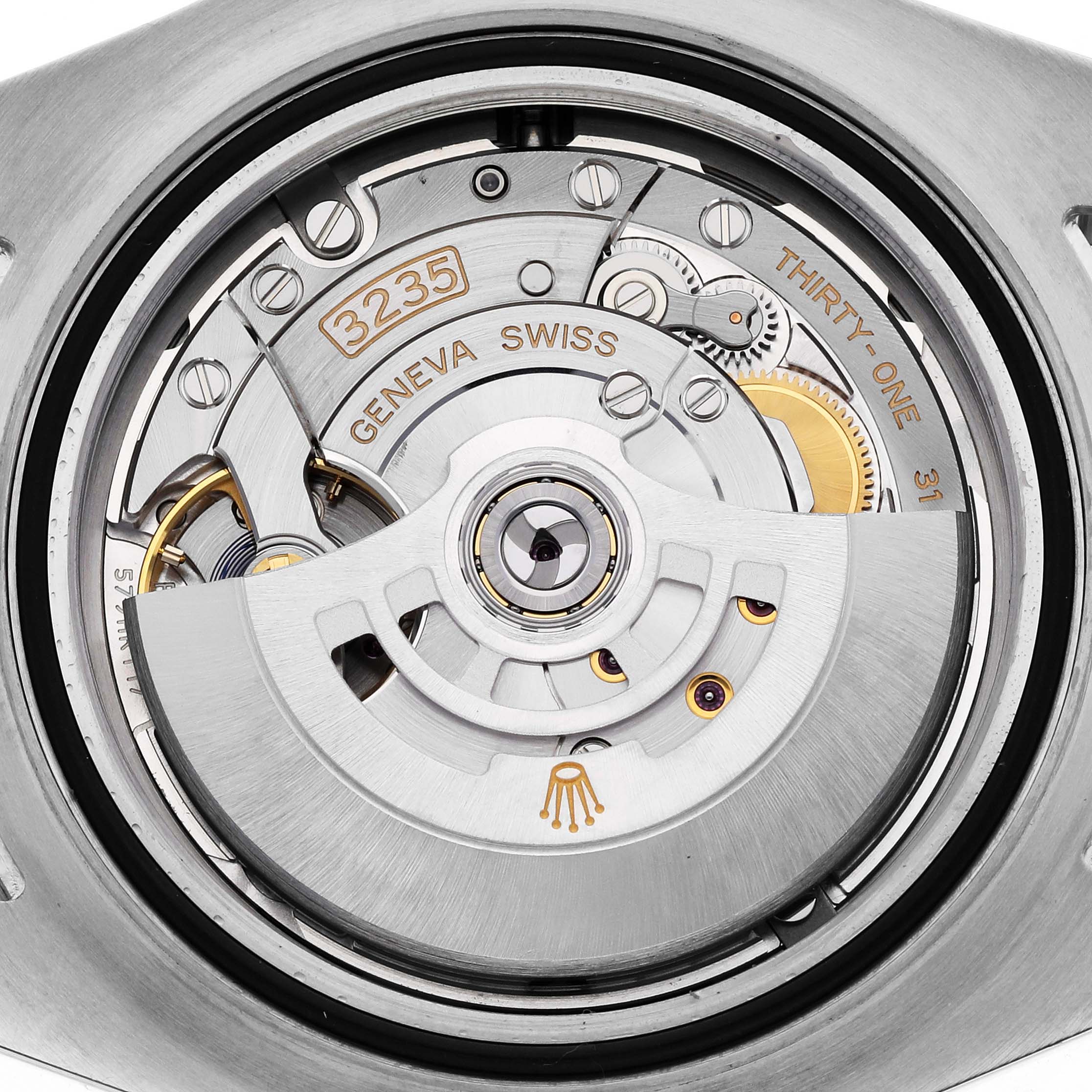 This is a close-up view of the movement mechanism of a Rolex Sea-Dweller 126603 Men
s Steel and Gold (two tone) Black Dial 126603 Men
s Steel and Gold (two tone) Black Dial watch, showcasing its intricate inner components.