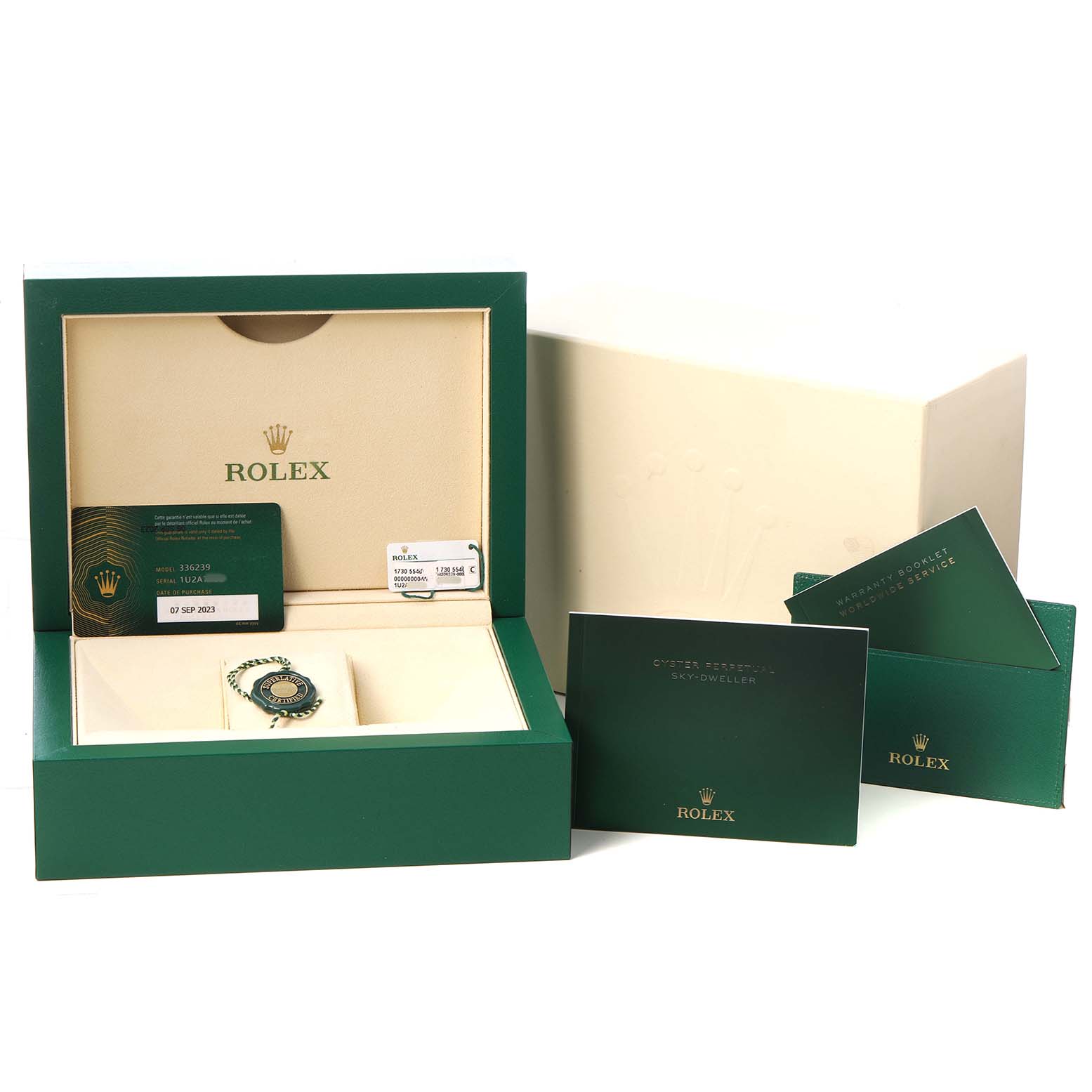 The image shows a Rolex Sky-Dweller 336239 Men's White Gold Black Dial watch box at an angle, including a warranty card, manuals, and a protective case.