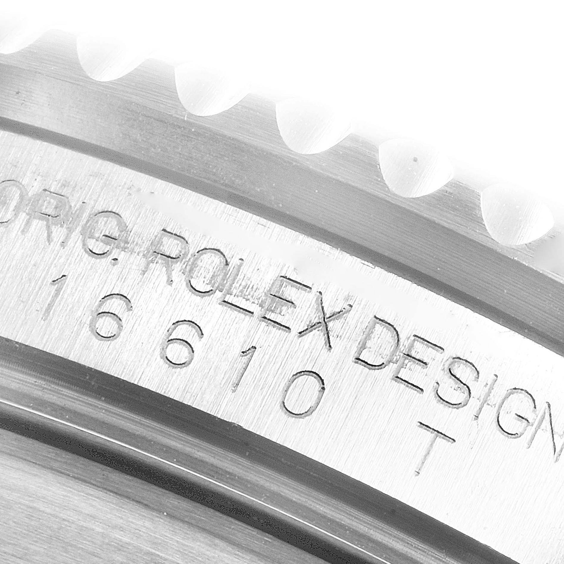 The image shows a close-up of the case side and the engravings on a Rolex Submariner 16610LV Men's Stainless Steel Black Dial 16610LV Men's Stainless Steel Black Dial model 16610.