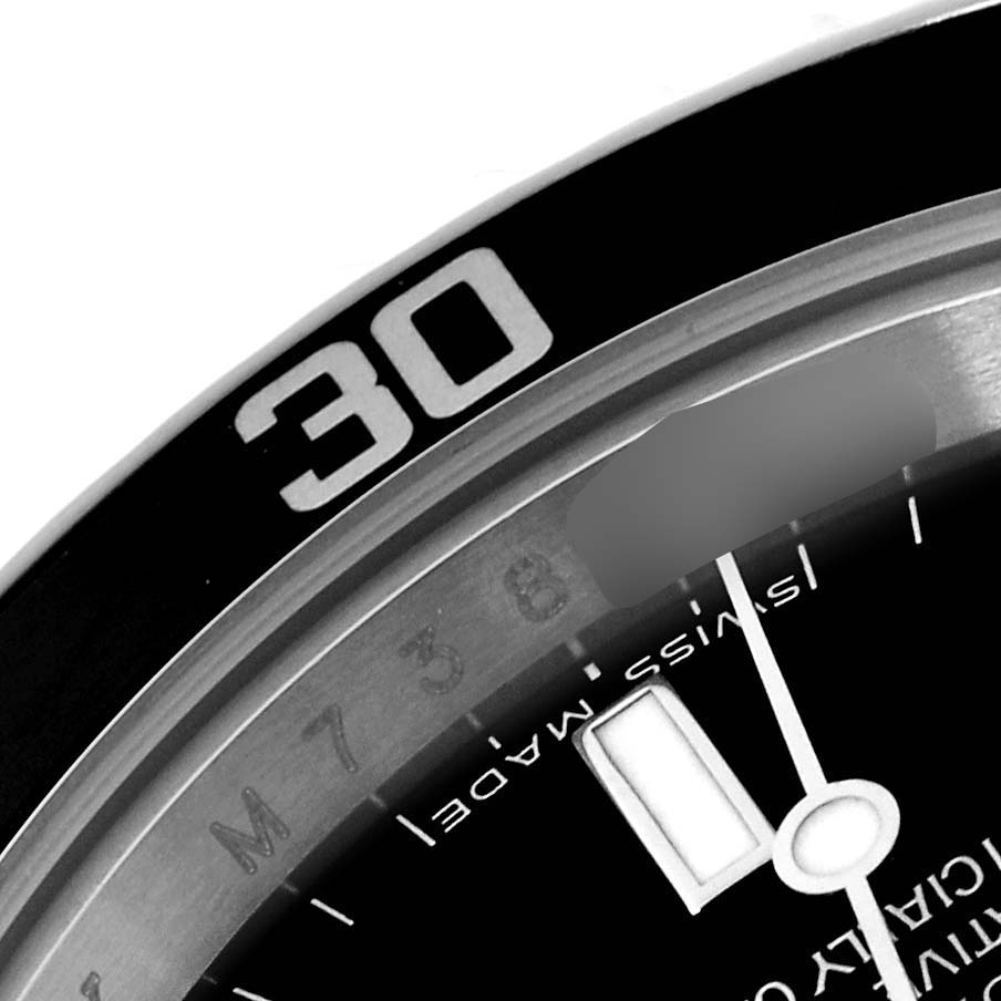 This close-up image of the Rolex Submariner 14060M Men
s Stainless Steel Black Dial 14060M Men
s Stainless Steel Black Dial shows a portion of the bezel with the "30" marking and part of the watch face with "SWISS MADE" text.