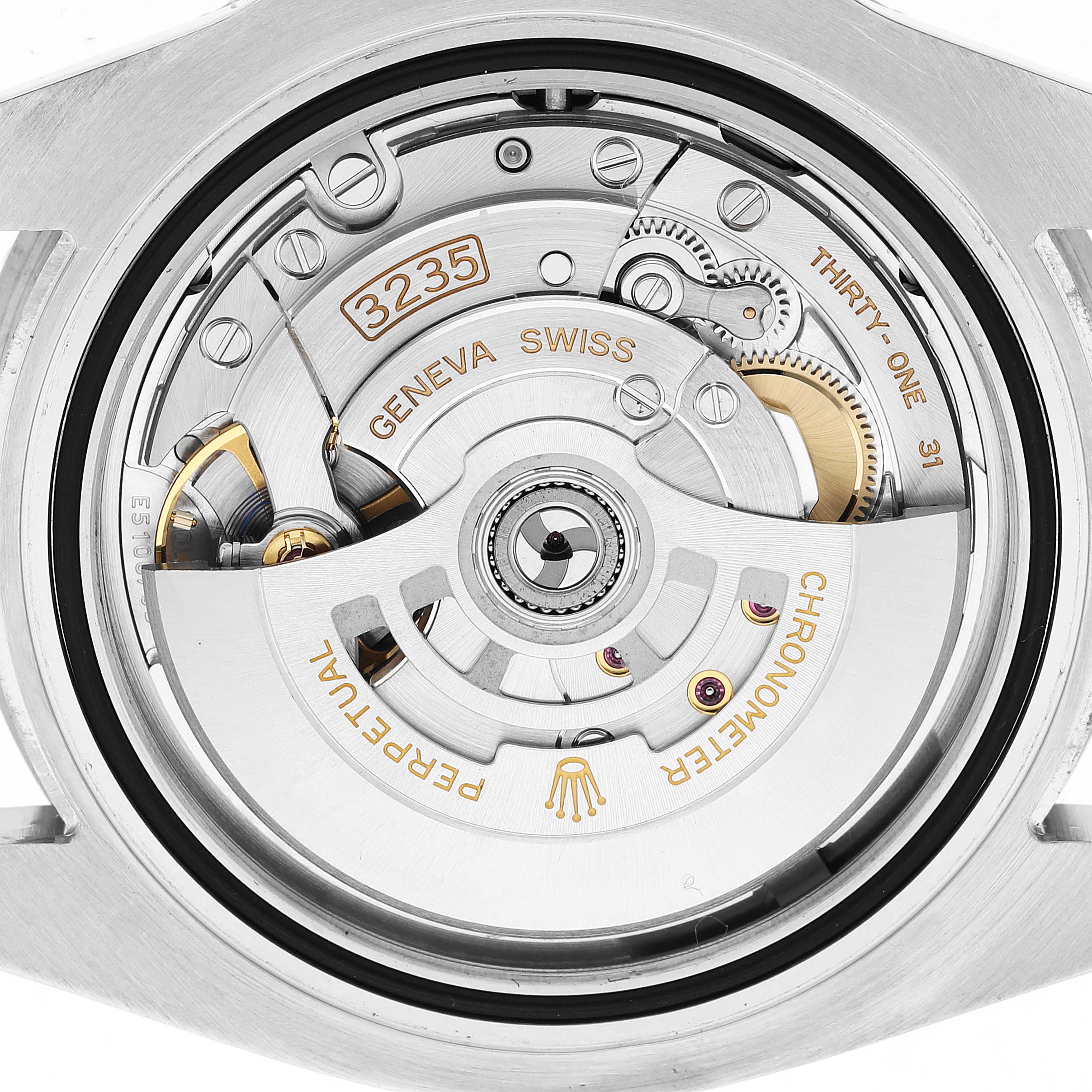 The image shows the movement of a Rolex Submariner M126610LV-0002 Men's Stainless Steel Black Dial watch from the back, highlighting its intricate mechanical components.