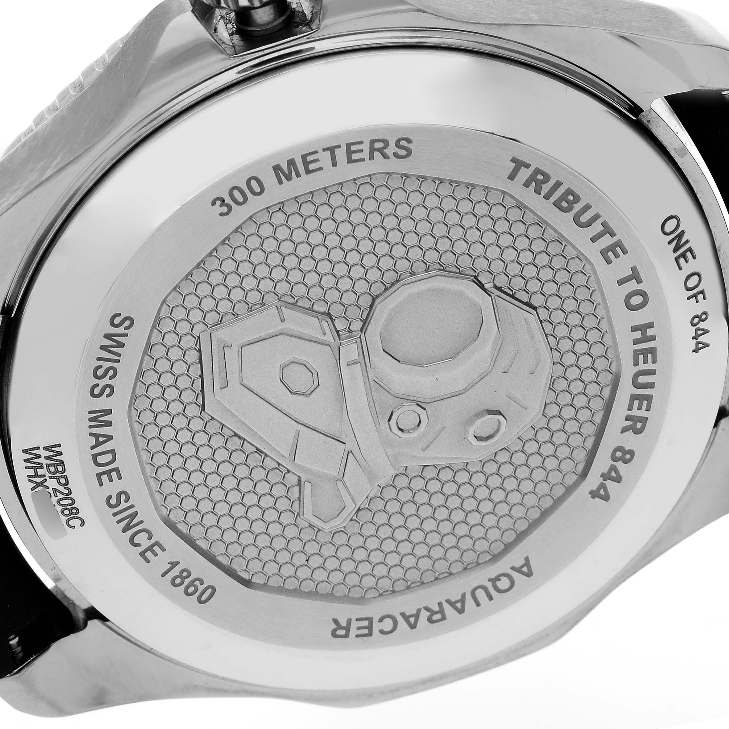 The image shows the back case of the Tag Heuer Aquaracer WBP208C.FT6201 Men's Titanium Black Dial WBP208C.FT6201 Men's Titanium Black Dial watch, highlighting the "Tribute to Heuer 844" engraving.