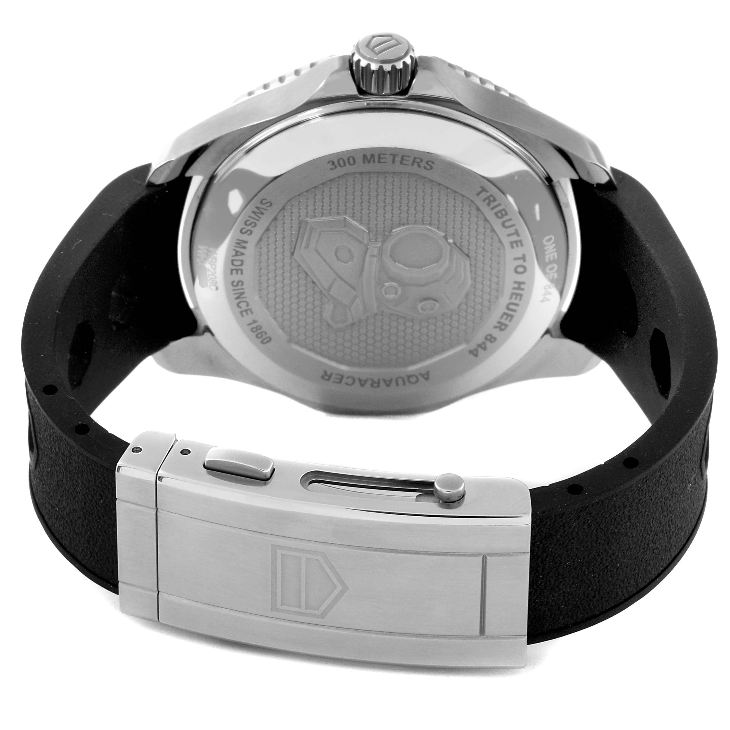The image shows the back view of a Tag Heuer Aquaracer WBP208C.FT6201 Men's Titanium Black Dial WBP208C.FT6201 Men's Titanium Black Dial watch, focusing on the case back engraving and the clasp of the strap.