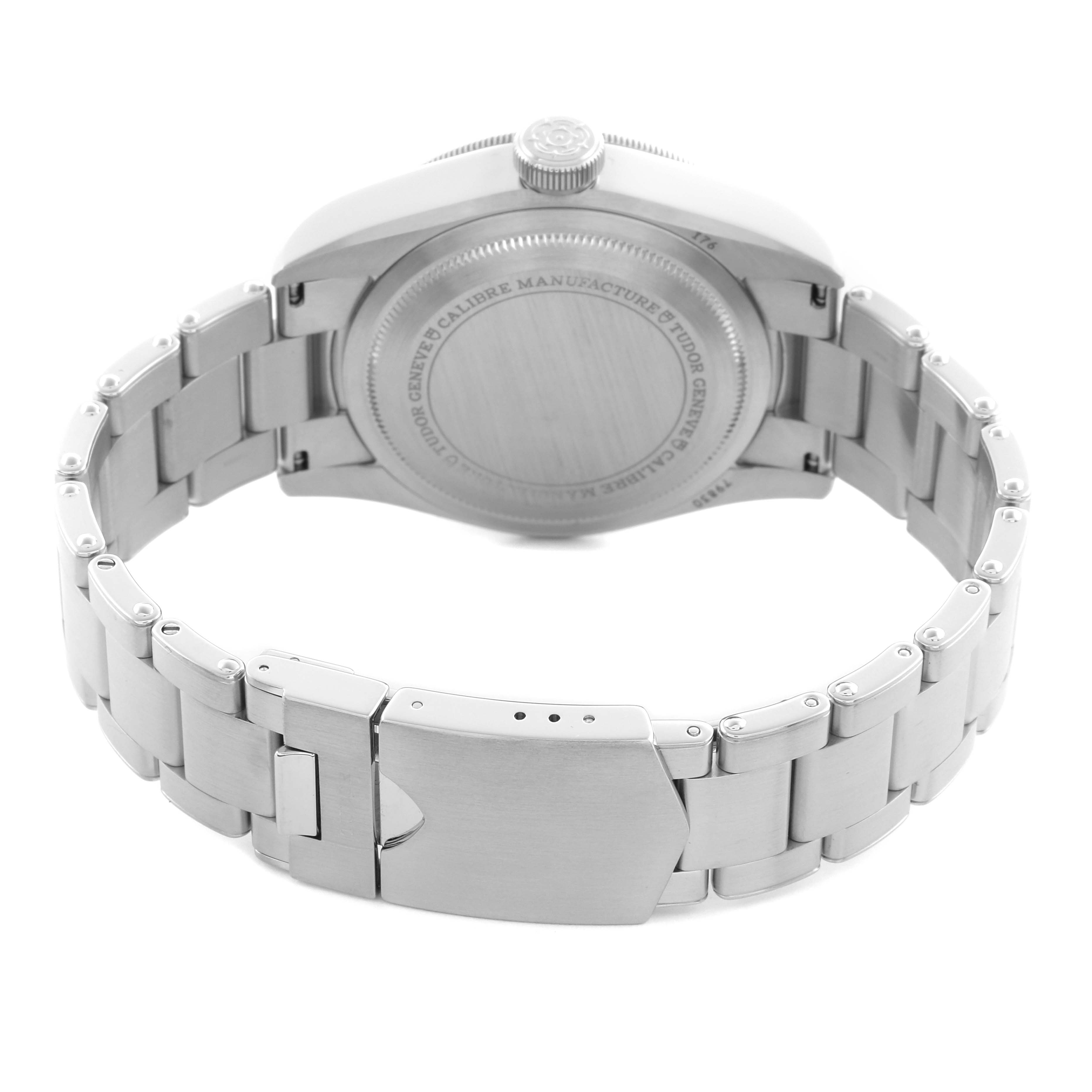 The image shows the case back and bracelet clasp of a Tudor Heritage Black Bay 79830RB Men
s Stainless Steel Black Dial 79830RB Men
s Stainless Steel Black Dial watch from a rear angle.