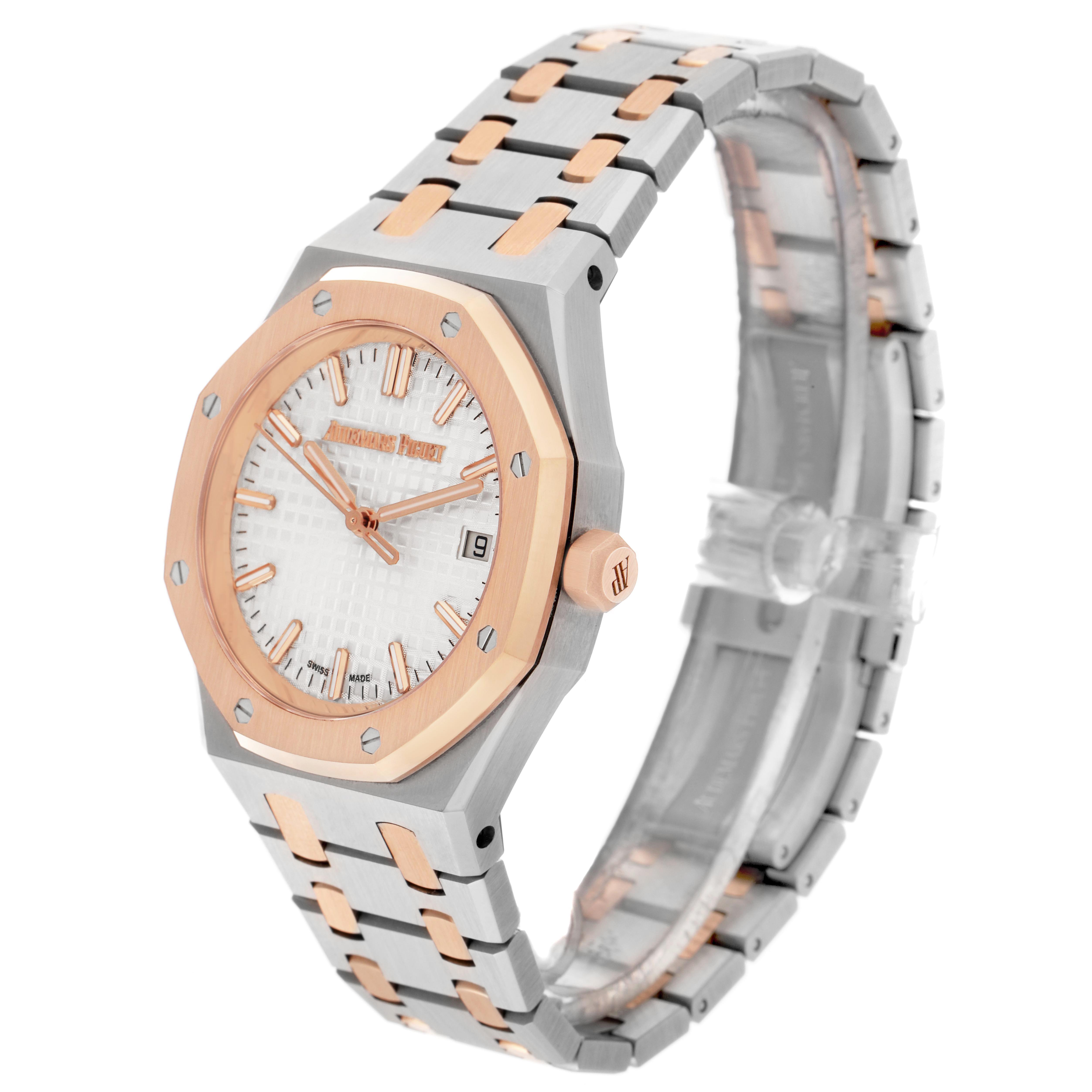 The Audemars Piguet Royal Oak 77350SR.OO.1261SR.01 Men
s Steel and Gold (two tone) Silver Dial watch is shown at a three-quarter angle, highlighting the dial, bezel, and bracelet.