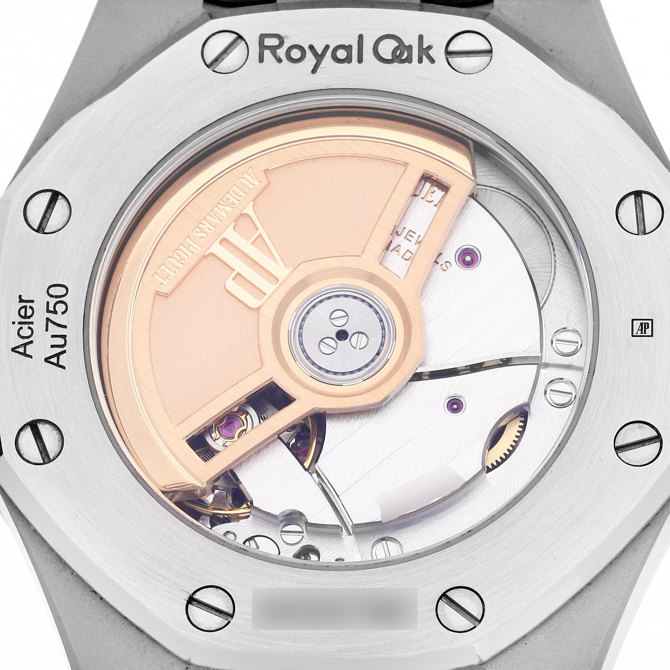 The image shows the back of an Audemars Piguet Royal Oak 77350SR.OO.1261SR.01 Men
s Steel and Gold (two tone) Silver Dial watch, highlighting the automatic movement and rotor.
