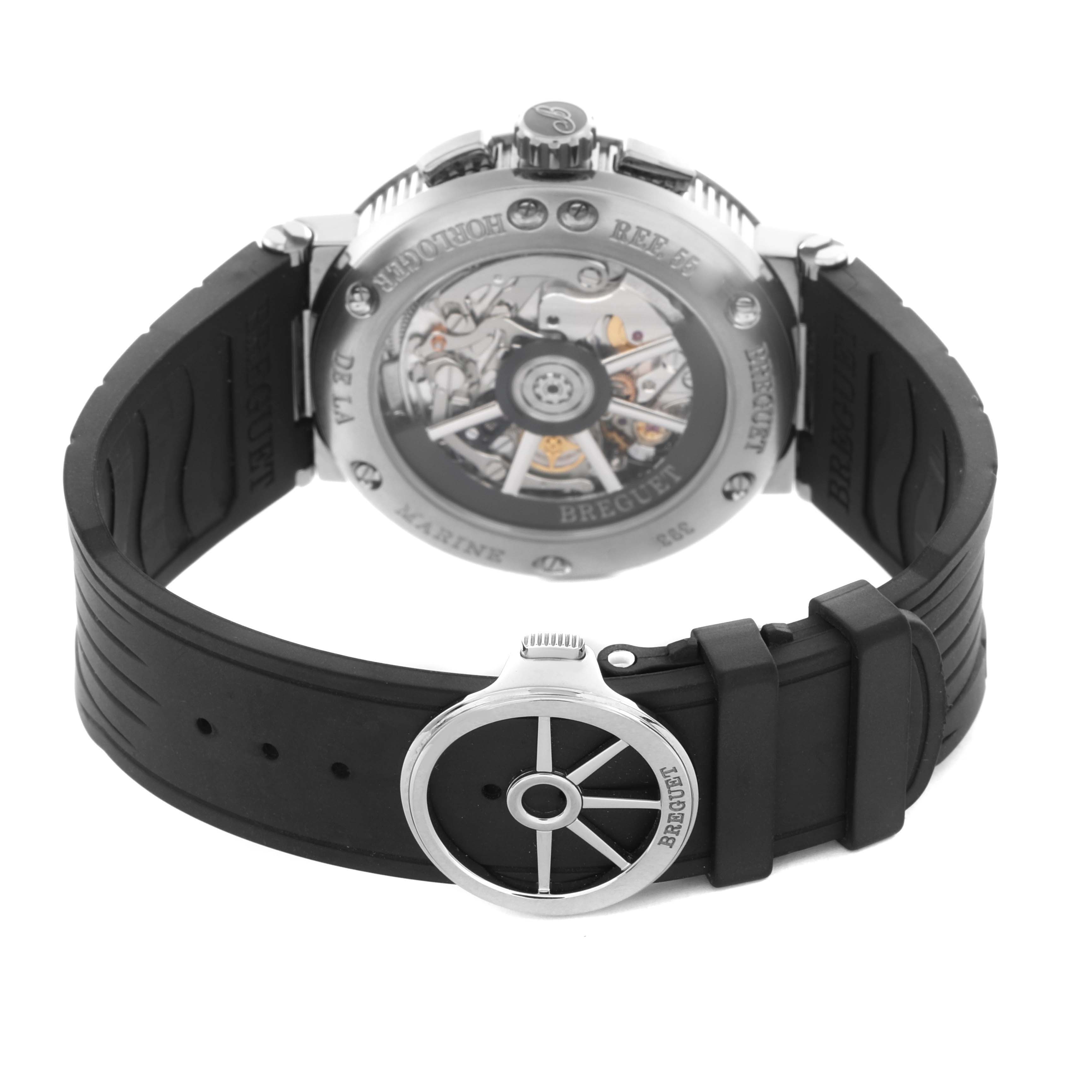 The image shows the back view of the Breguet Marine G5527I/G2/5WV Men
s Titanium Grey Dial G5527I/G2/5WV Men
s Titanium Grey Dial watch, highlighting the movement and a black rubber strap with clasp.