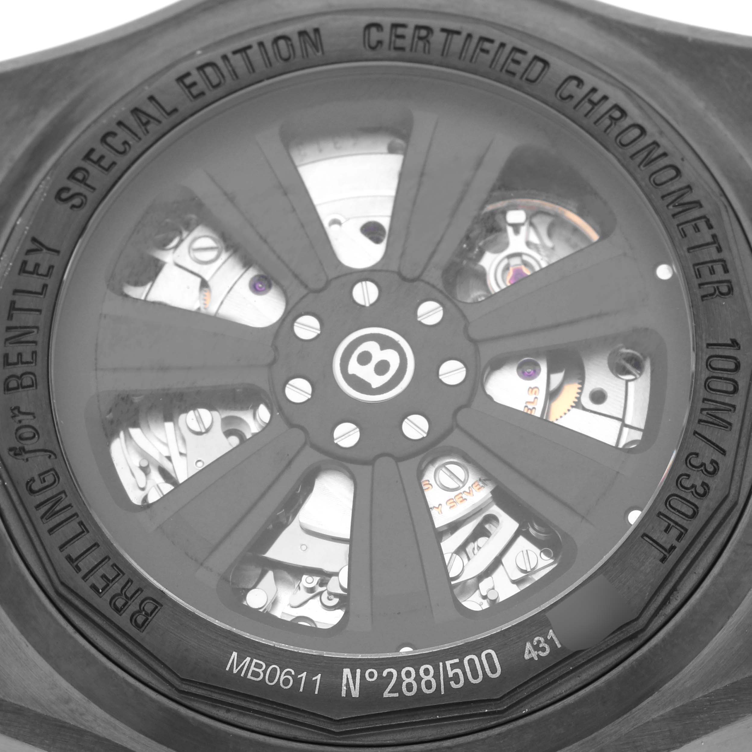The image shows the back of the Breitling Bentley MB061113/BE60 Men's Stainless Steel Mother of Pearl Dial MB061113/BE60 Men's Stainless Steel Mother of Pearl Dial watch, highlighting its internal mechanisms and inscriptions.
