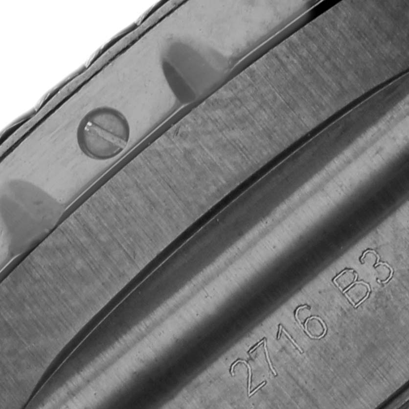 The image shows a close-up angle of the case back, showcasing the serial number, of a Bentley model by Breitling.