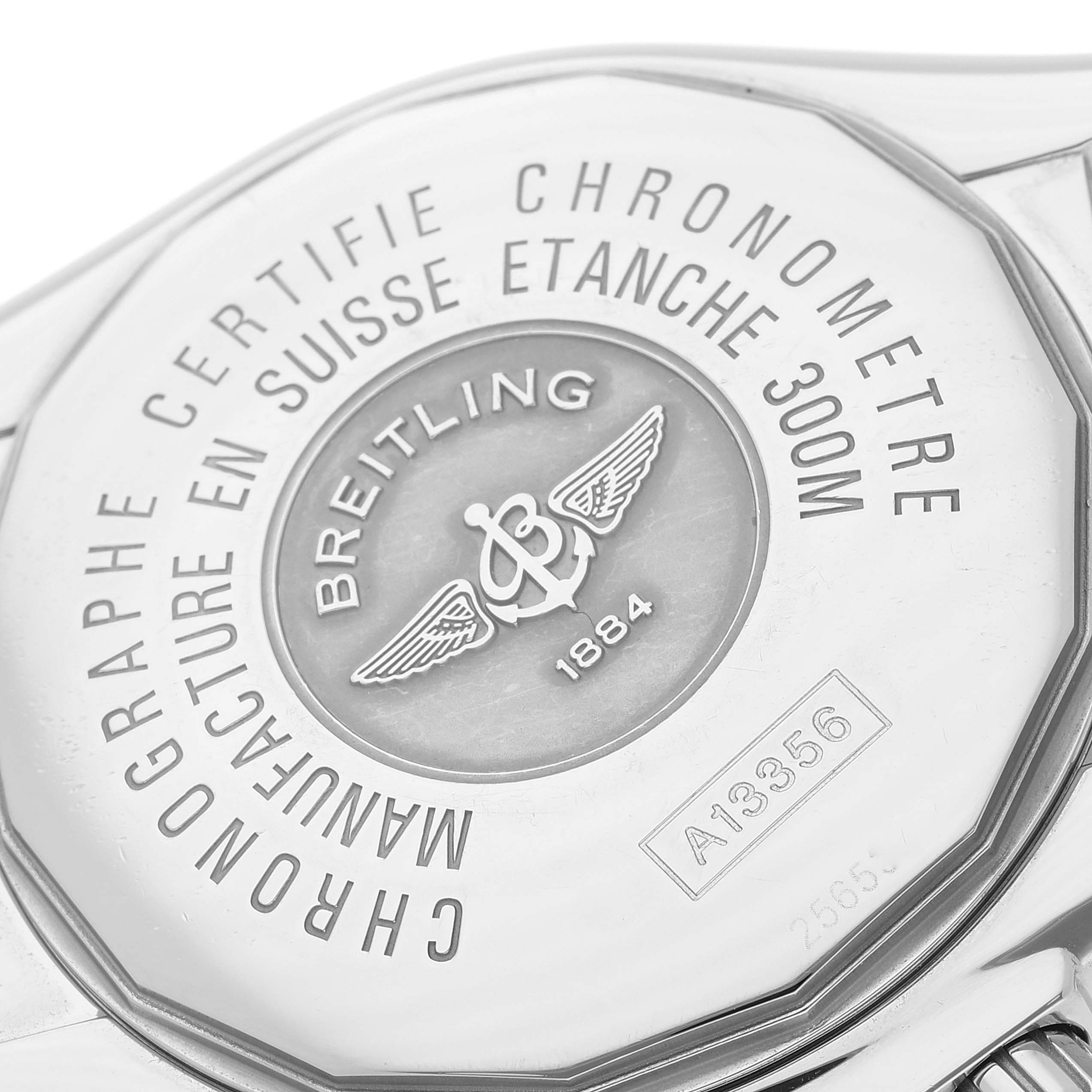 The image shows the case back of a Breitling Chronomat A13356 Men
s Stainless Steel Blue Dial A13356 Men
s Stainless Steel Blue Dial watch, displaying the brand logo, model number, and specifications.