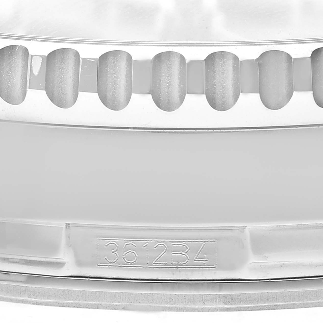 Close-up view of a numbered Navitimer watch bezel by Breitling, highlighting its distinct knurling and unique serial number.