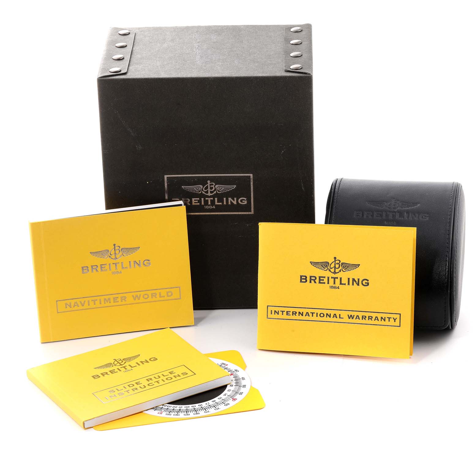 The image shows accessories for a Breitling Navitimer A24322 Men's Stainless Steel Black Dial A24322 Men's Stainless Steel Black Dial watch, including boxes, manuals, and a warranty card, displayed from the front.
