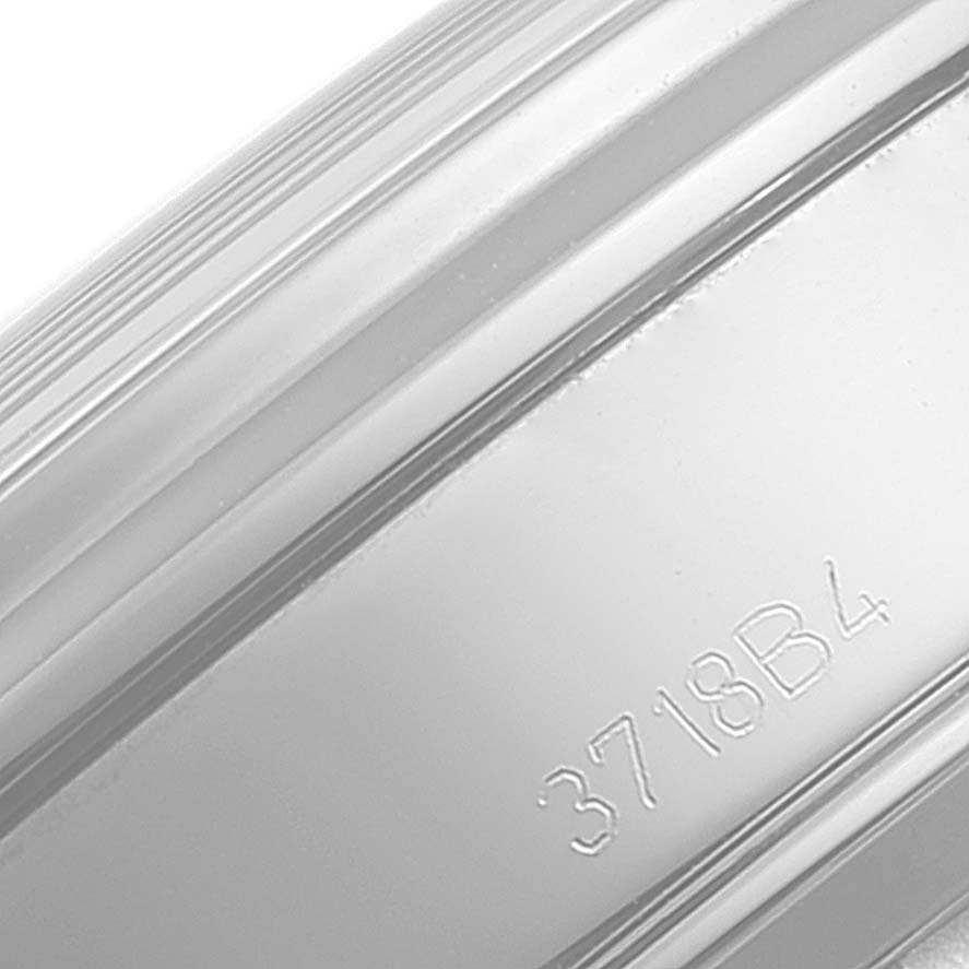 This close-up image shows the engraved side of the case or bezel of a Breitling Premier A13315 Men's Stainless Steel Blue Dial A13315 Men's Stainless Steel Blue Dial model watch.