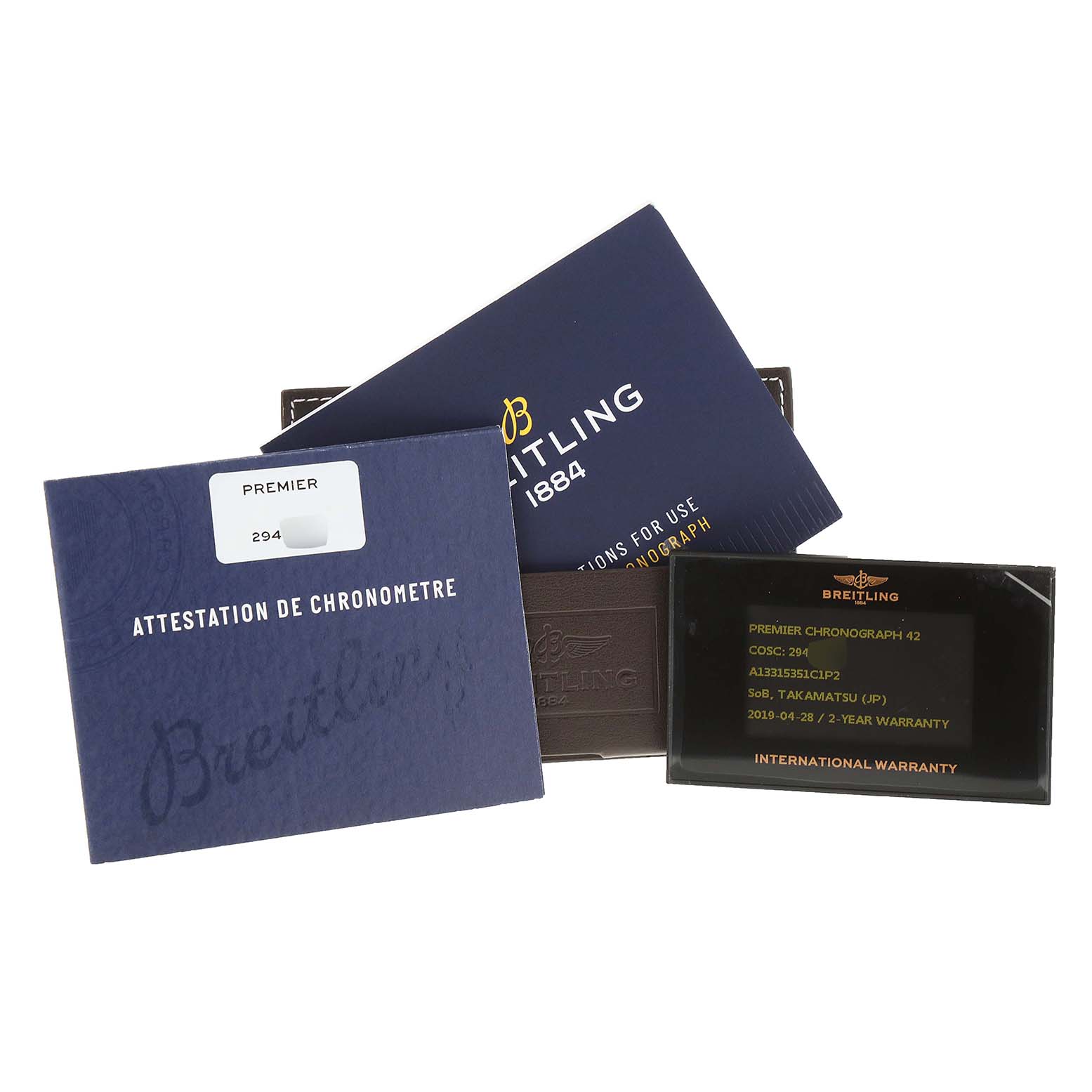 This image shows the warranty, chronometer certificate, and documentation for the Breitling Premier A13315 Men's Stainless Steel Blue Dial A13315 Men's Stainless Steel Blue Dial model watch.