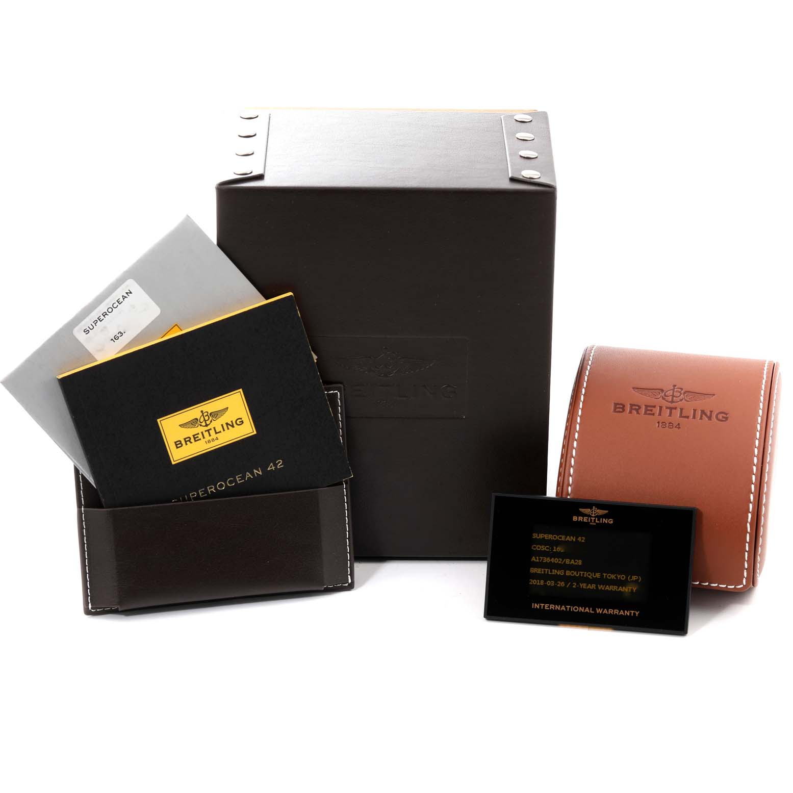 The image shows packaging and documentation for a Breitling Superocean A17364 Men's Stainless Steel Silver Dial A17364 Men's Stainless Steel Silver Dial watch, including a box, manual, warranty card, and leather storage case.