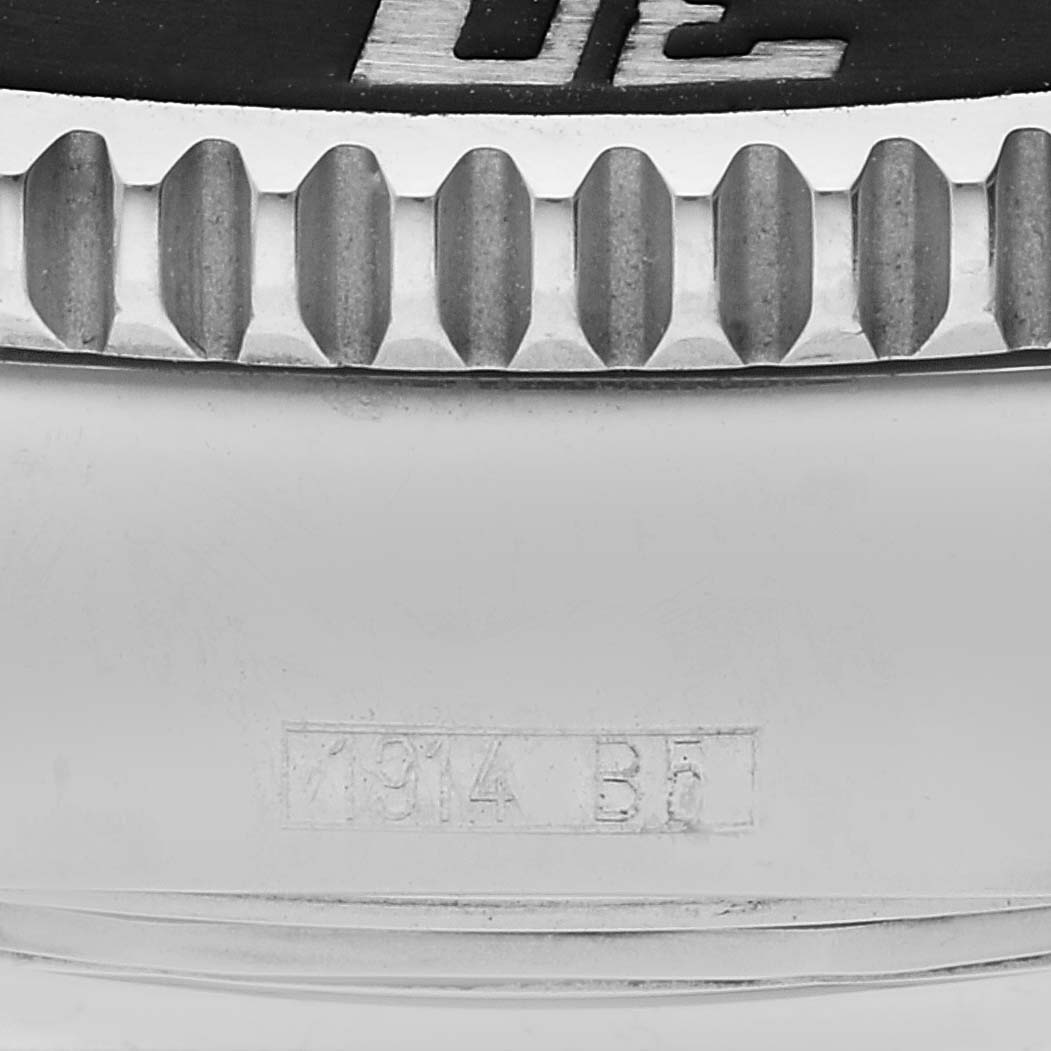 This image shows a close-up of the bezel and part of the case back of the Breitling Superocean A17364 Men's Stainless Steel Silver Dial A17364 Men's Stainless Steel Silver Dial watch with model engraving visible.