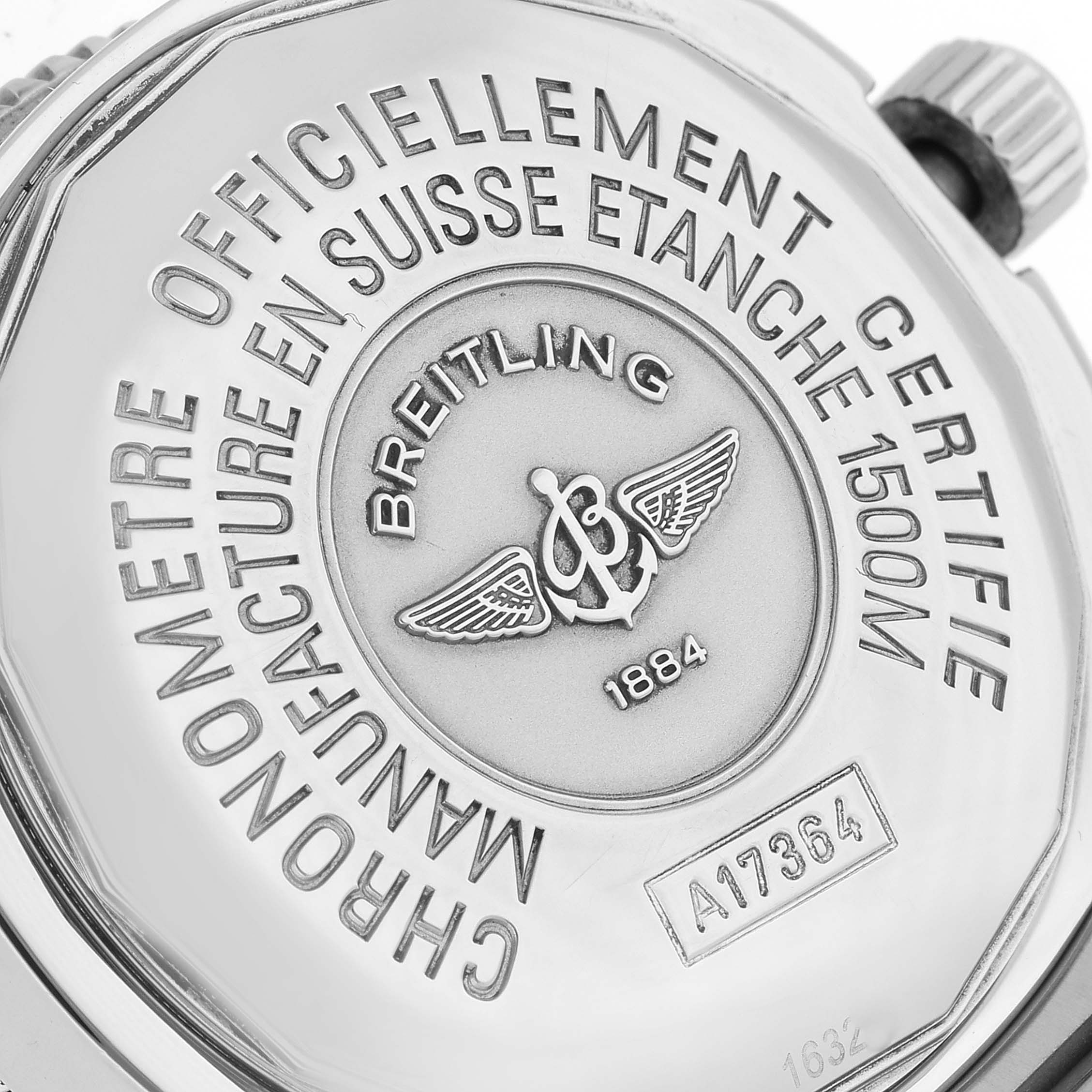 This image shows the back case of the Breitling Superocean A17364 Men's Stainless Steel Silver Dial A17364 Men's Stainless Steel Silver Dial watch, displaying inscriptions and the brand logo.