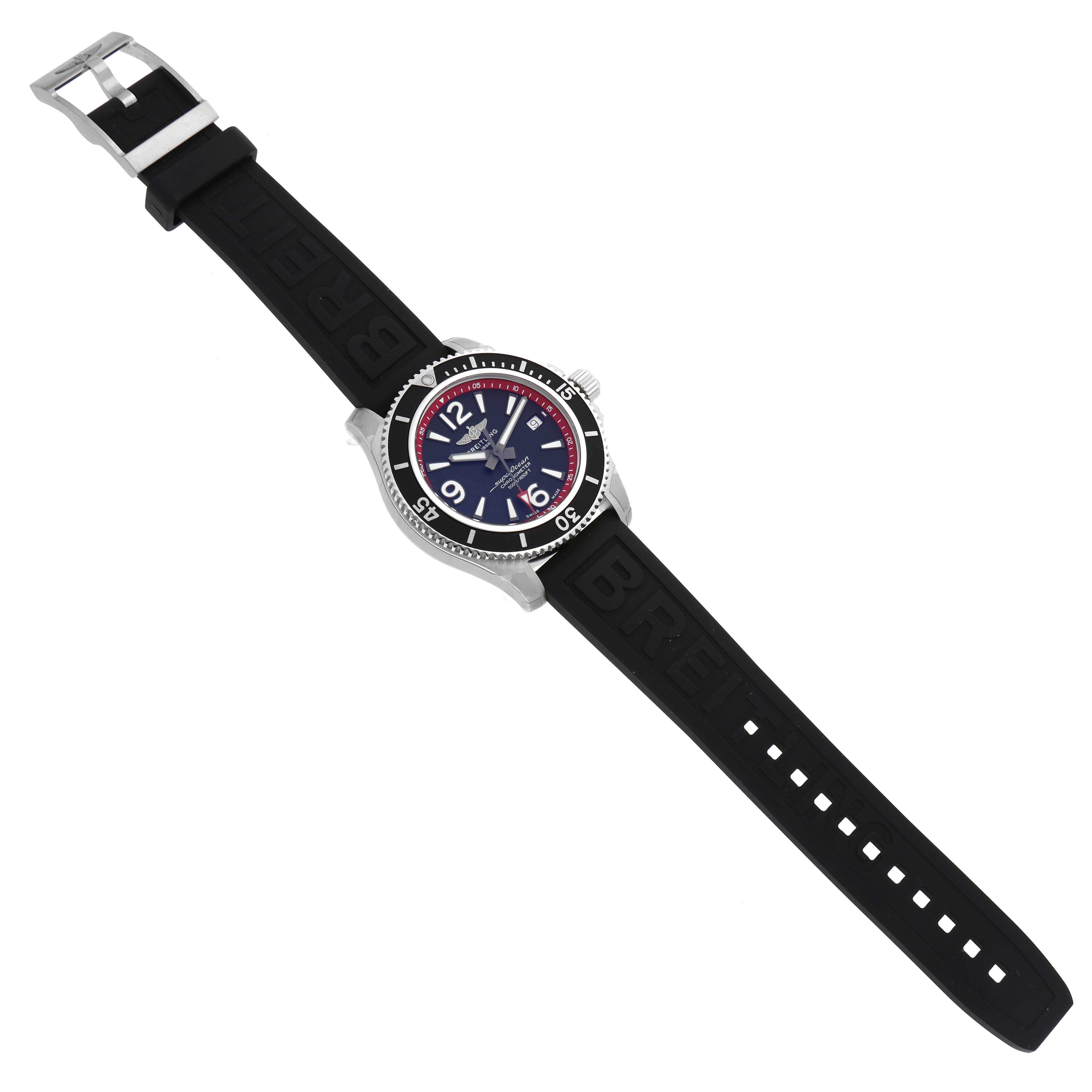 The Breitling Superocean A17366D71B2S1 Men's Stainless Steel Black Dial A17366D71B2S1 Men's Stainless Steel Black Dial watch is shown from a top-down angle, displaying its black rubber strap, bezel, and face with red and blue accents.