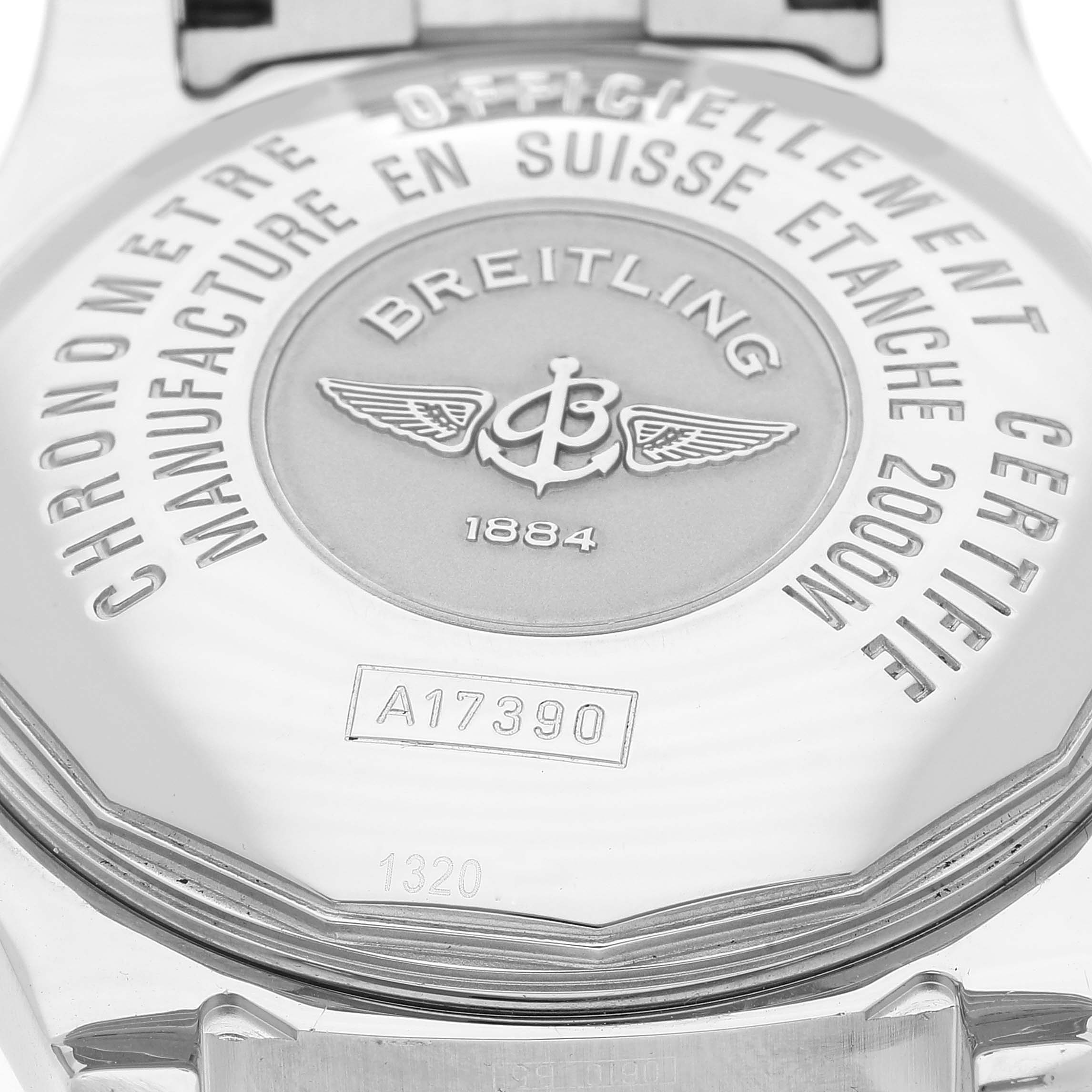 This image shows the back case of a Breitling Superocean A17390 Men's Stainless Steel Black Dial A17390 Men's Stainless Steel Black Dial watch at a close-up angle, highlighting the engraved text and logo.